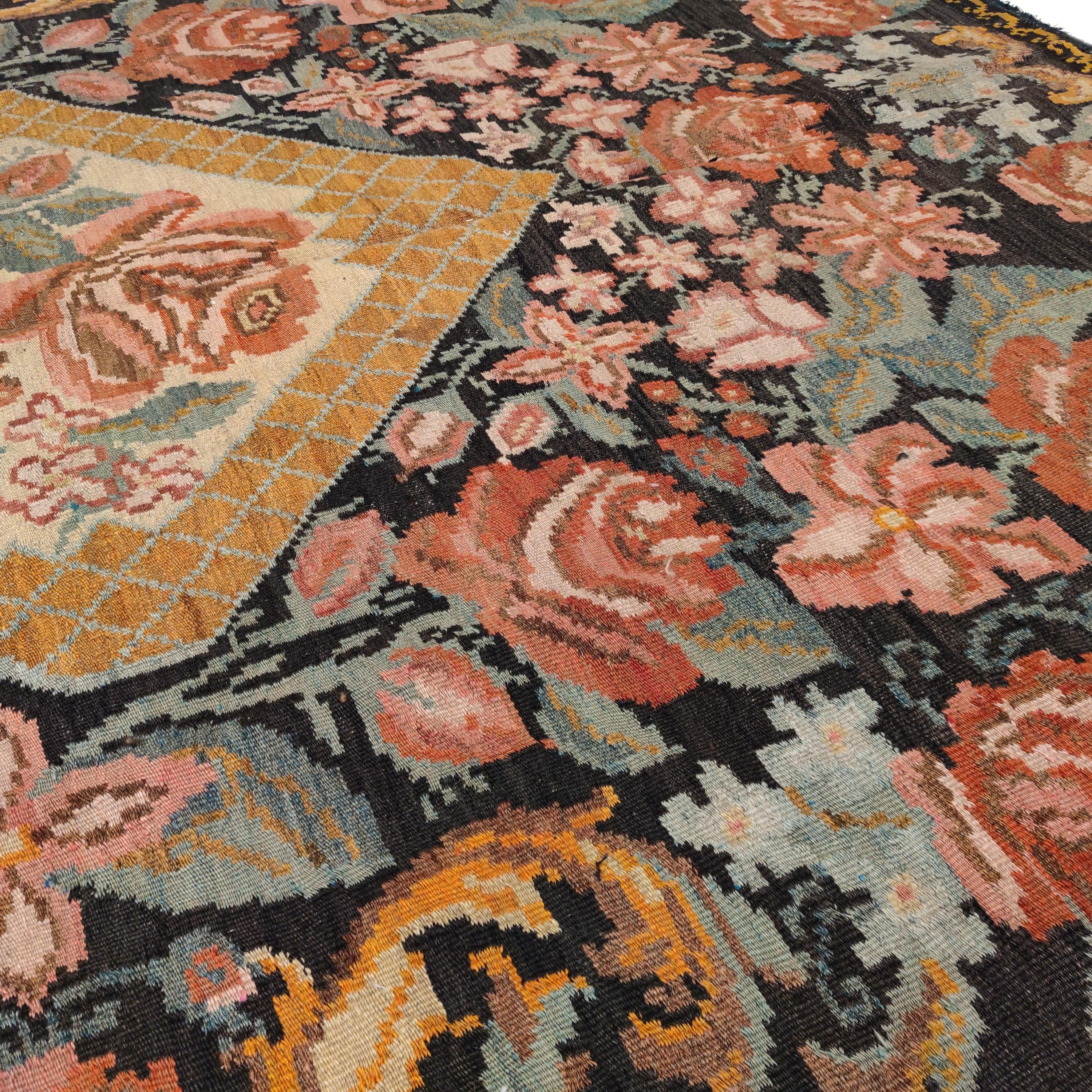 Wool Vintage Black Ground Bessarabian Kilim with Botanical Pattern For Sale