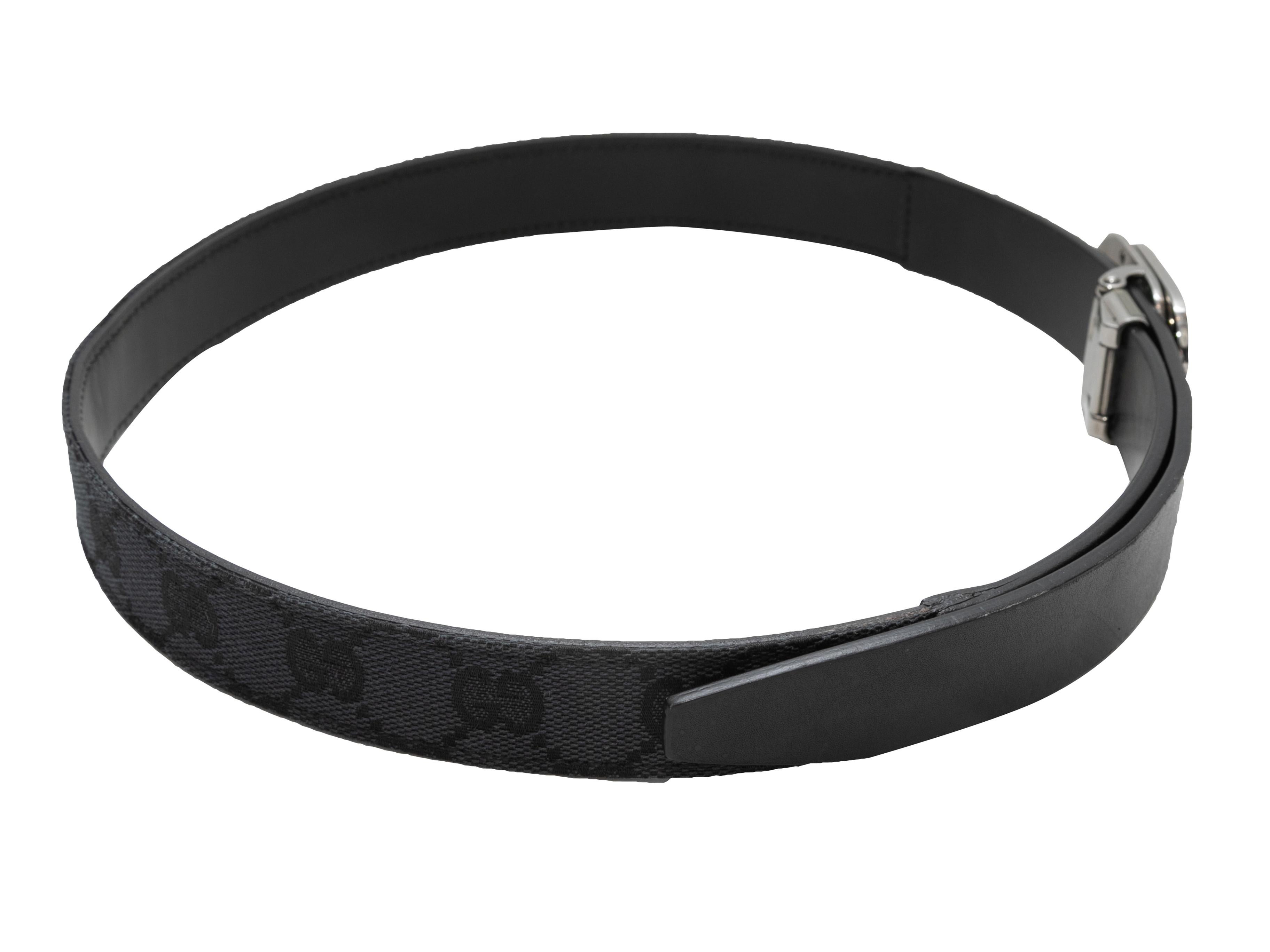 Vintage black leather logo buckle belt by Gucci. Circa early 2000s. Silver-tone buckle closure. 1.5