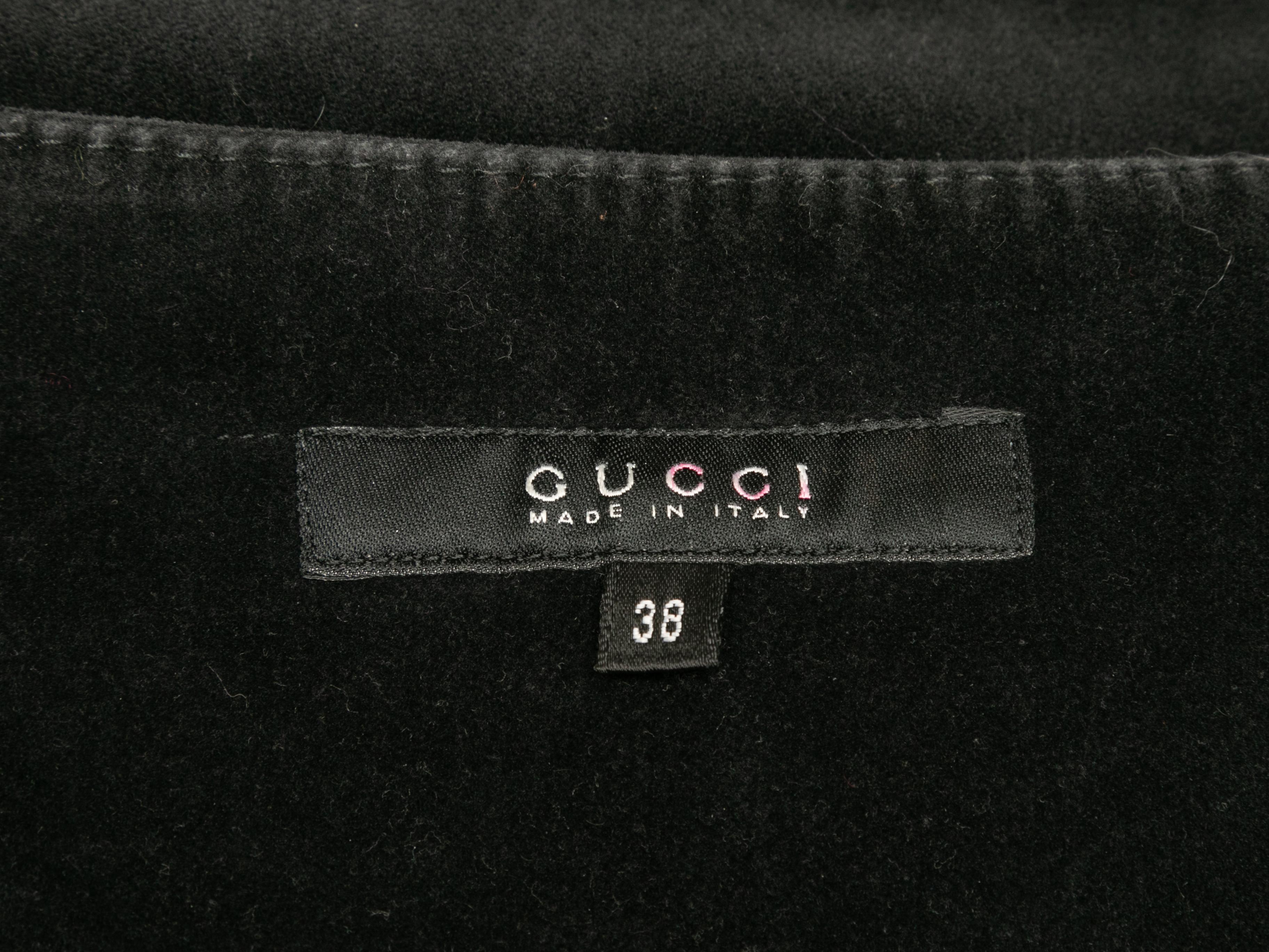 Vintage black velvet skinny pants by Gucci. From the Fall/Winter 2002 Tom Ford Era Collection. Side closure. 31