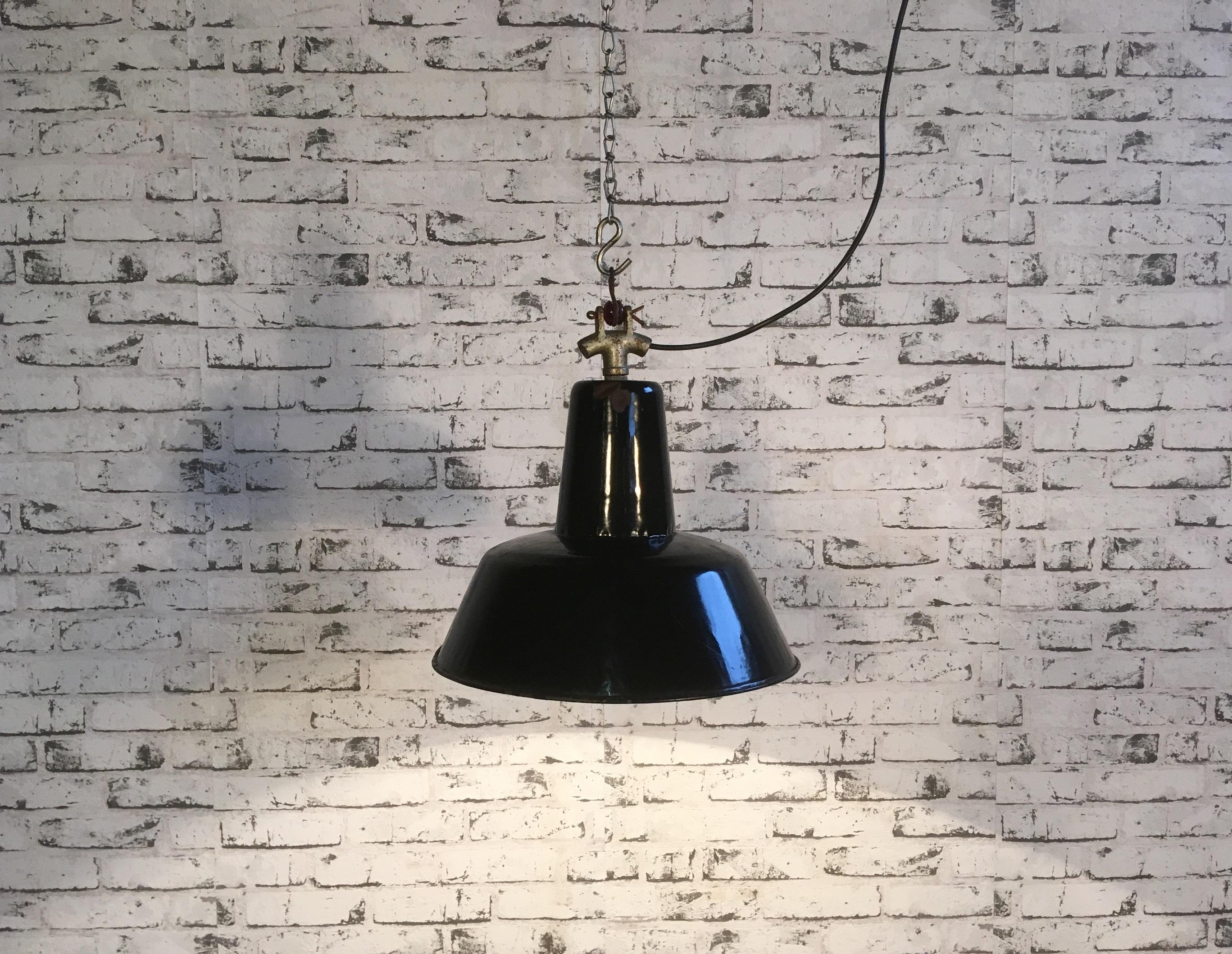 Pendant lamp from former Czechoslovakia, previously used in a factories.
Made from enameled metal. Black outside, white interior.Interesting cast iron top.
New socket E 27 and wire.