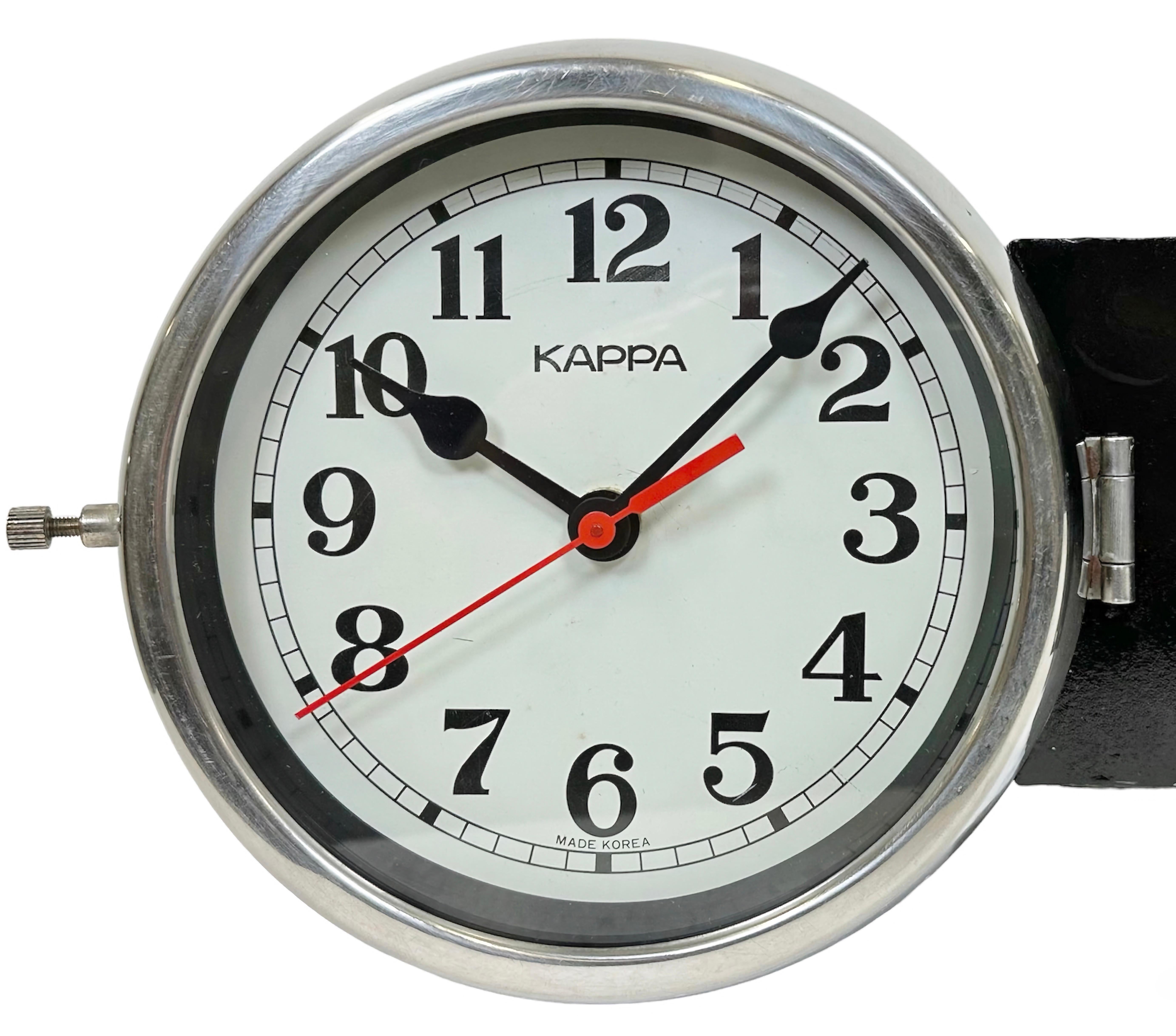 Vintage Industrial Kappa navy slave clock designed during the 1980s in South Korea. These clocks were used on large tankers and cargo ships. It features a black metal body, a metal dials and a clear glass covers with chrome frames. Former slave