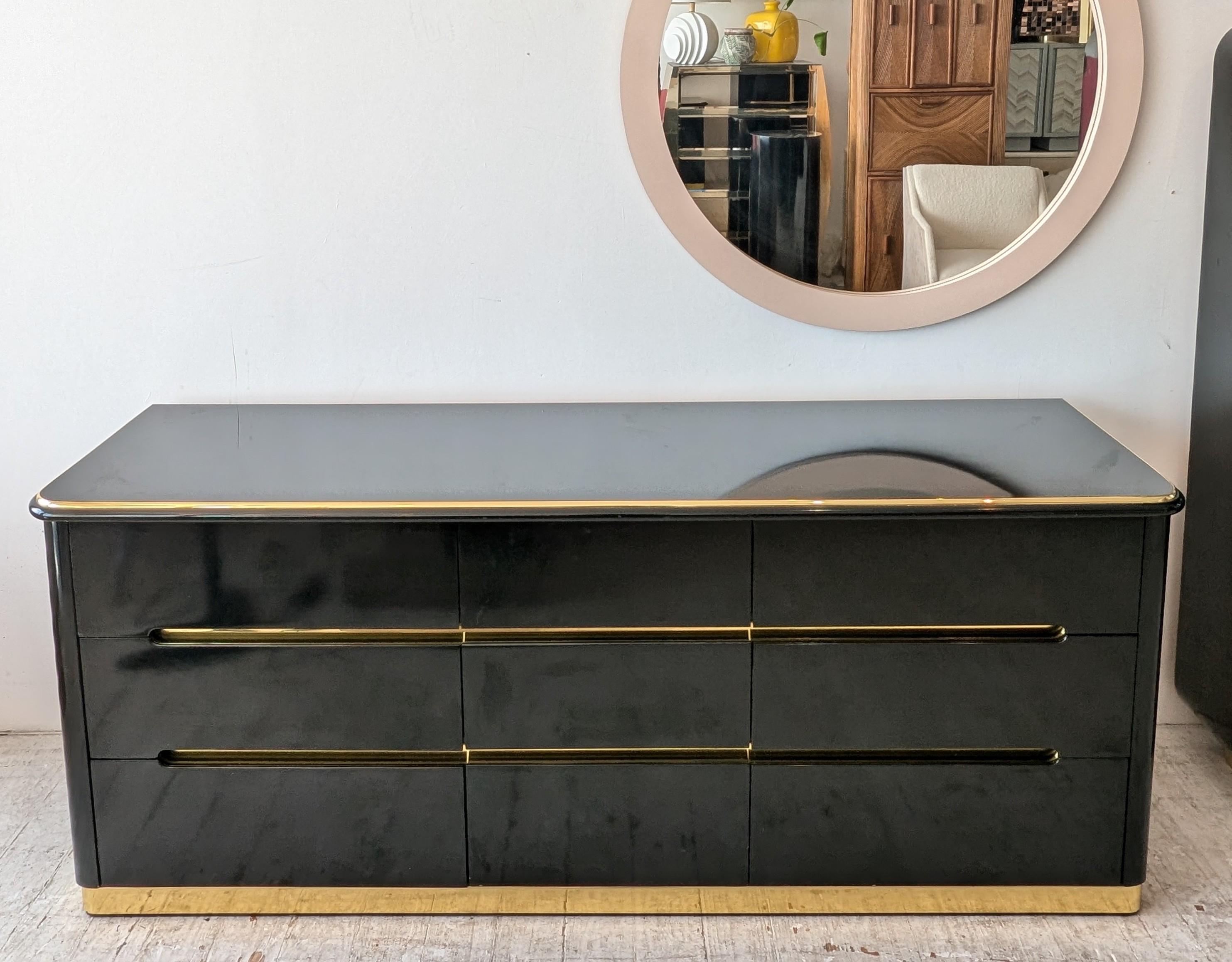 Sleek black lacquer & gold deco revival sideboard with drawers, by Lane Furniture USA, 1980s. Nine large drawers with indented handles, with inset gold metal detailing.

Please try to ignore the fingerprints: I thought I'd buffed them off before