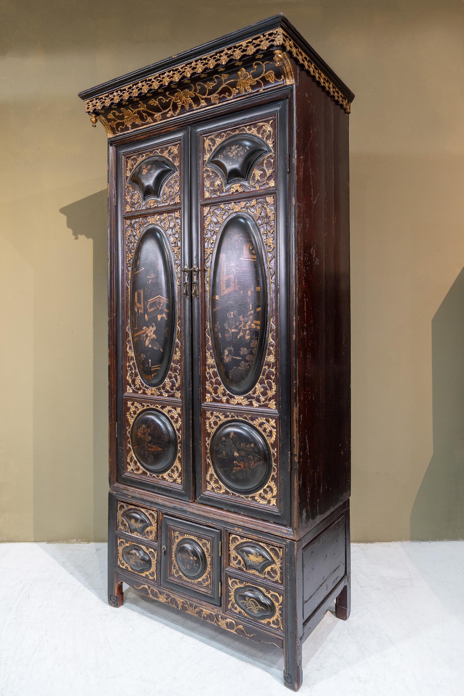 An excellent 2-tier black lacquered cabinet from Chaozhou province, China. The bulbous panels on the front and the coloured interior are very typical designs of Chaozhou cabinets from that time. The protruding roof on this piece makes it a little
