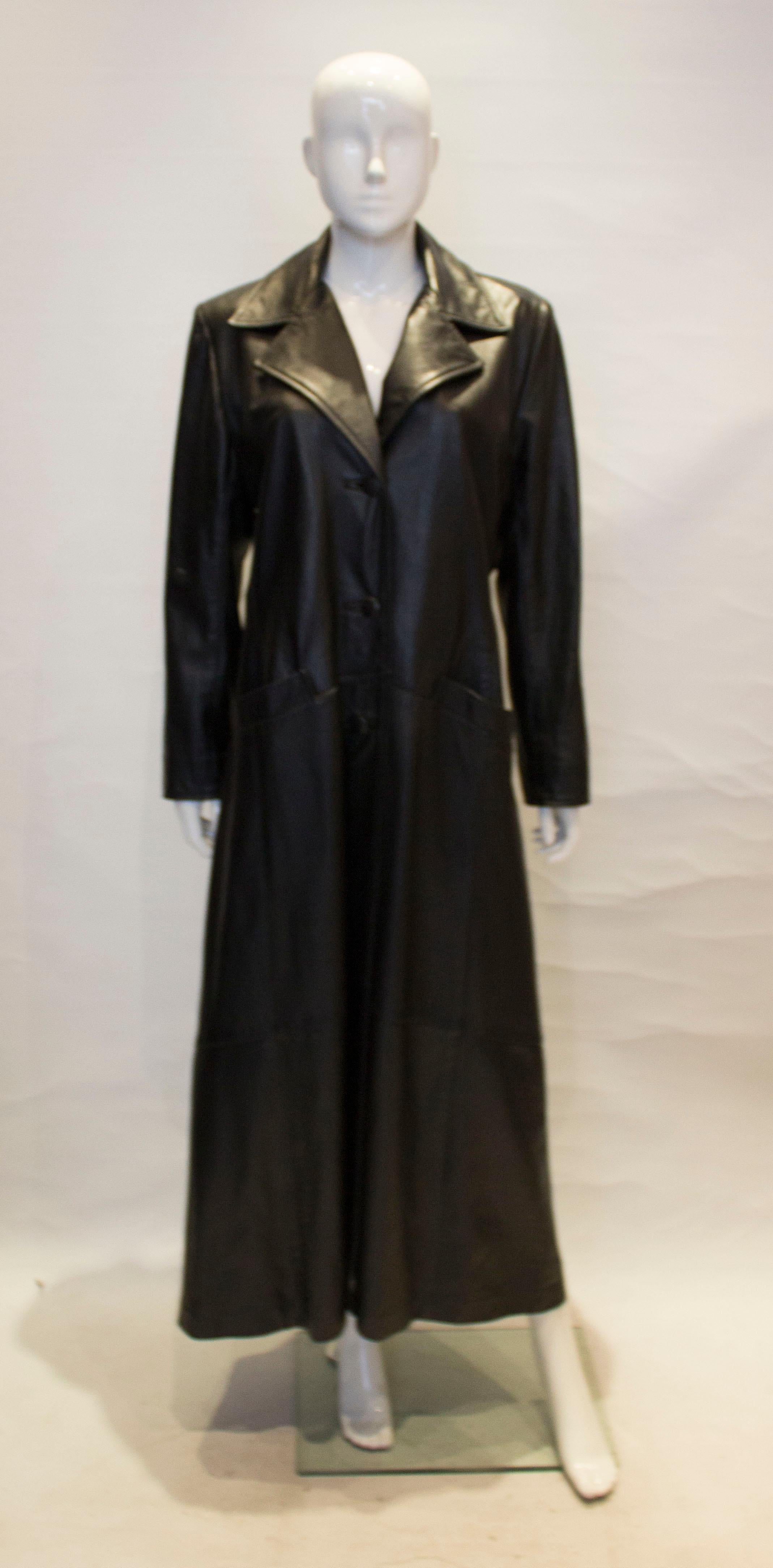 Just in time for the cooler weather , this vintage black leather coat is right on trend. 
It has a three button cuff detail and three button front opening and three button opening at the back . The coat is fully lined.