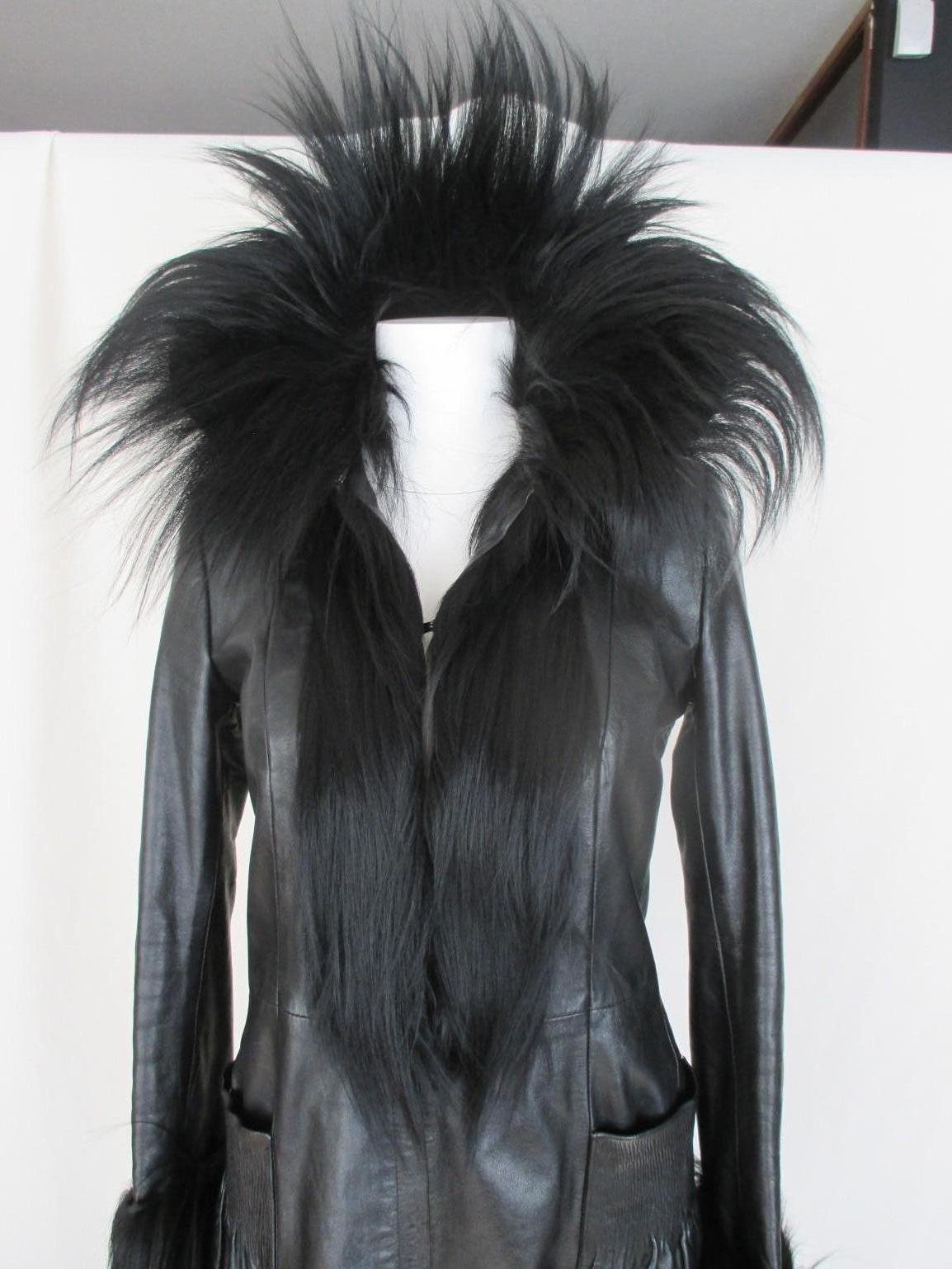 This vintage coat is made from black leather with black yak fur details, has 2 pockets, 1 zipper, 3 closing hooks and narrow sleeves.
Its in pre-loved vintage condition with some wear at the lining.
Size - Small 

Please note that vintage items are