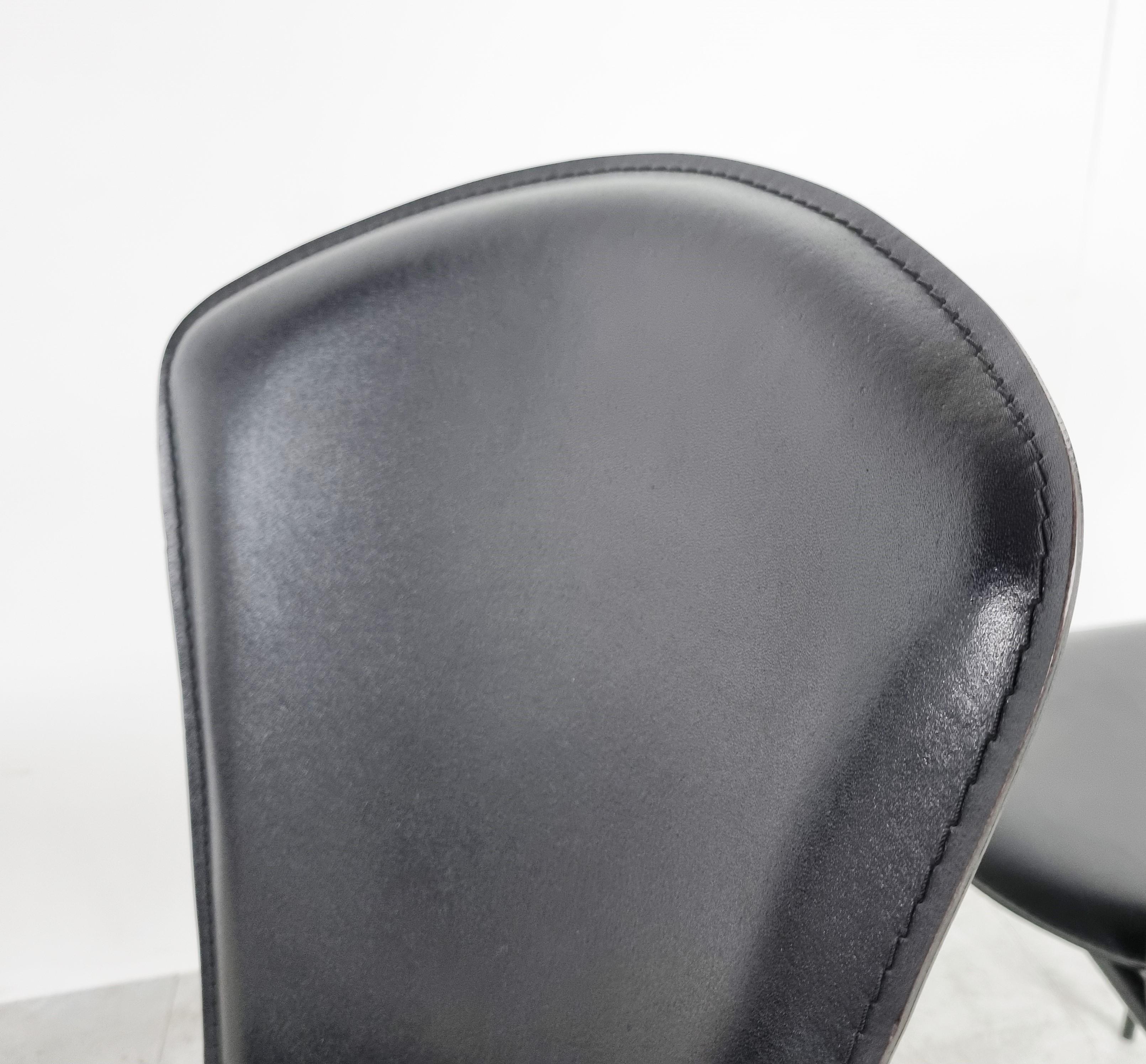 Set of 6 leather dining chairs in the style of Giancarlo Vegni. 

The chair seat well, are beautifully designed and made from quality materials.

Black leather upholstery and black lacquered metal frames.

The chairs are in very good condition