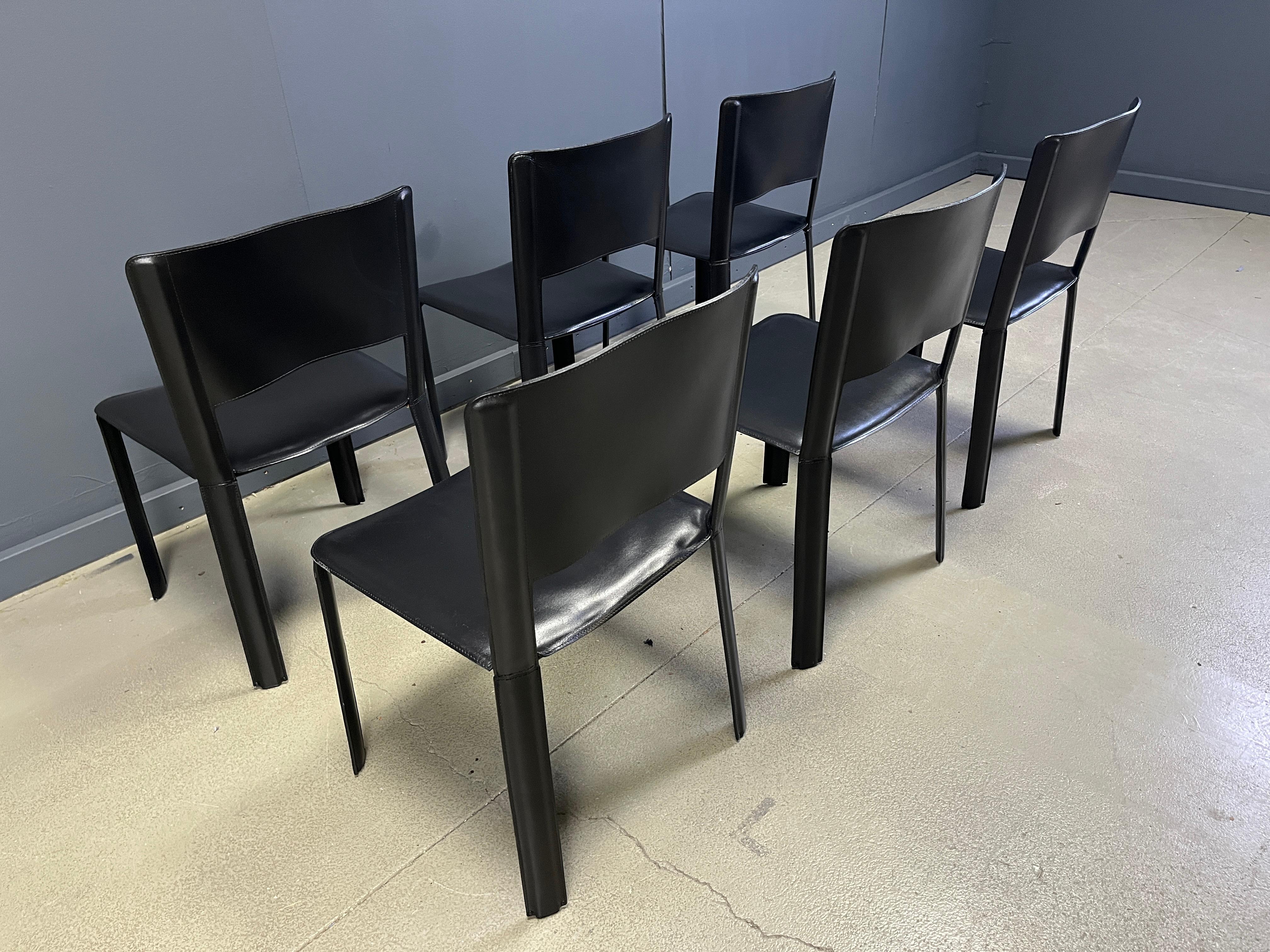 Vintage black leather italian dining chairs from the 1980s

Beautiful timeless design with fully stiched leather upholstery.

Very good quality.

Good condition with normal age related wear.

Chairs are labelled at the back.

Dimensions:
Height: