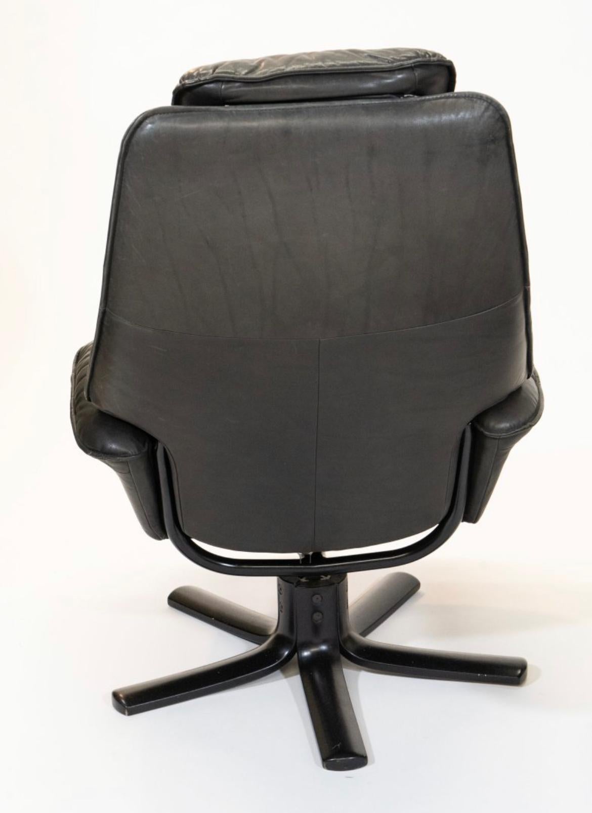 Mid-Century Modern Vintage Black leather lounge chair with ottoman by Hjellegjerde Made in Norway