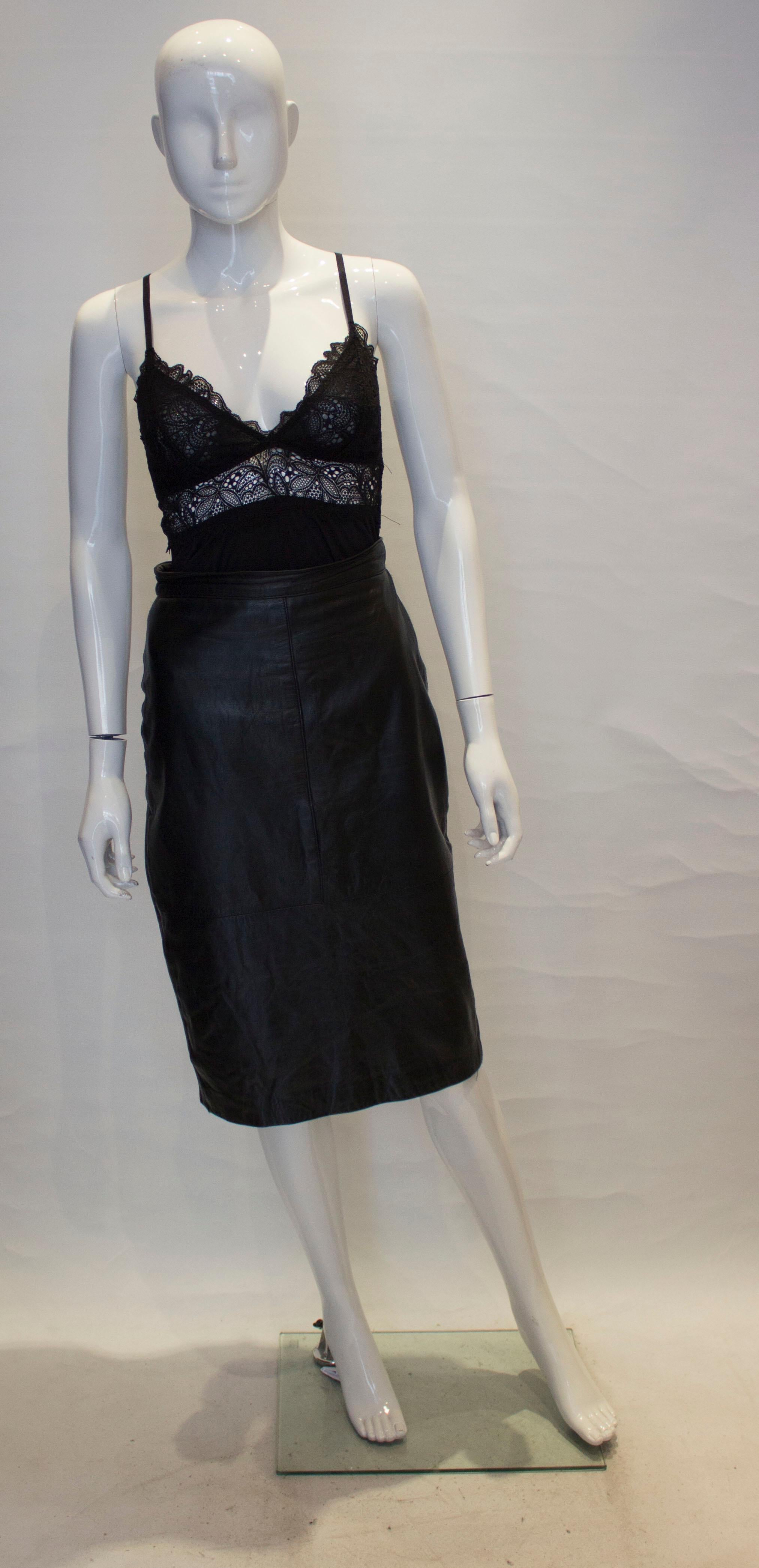 A simple and sophisticated vintage black leather skirt, ideal for work or play.
The skirt is fully lined, with a back central zip and 8'' slit at the rear.