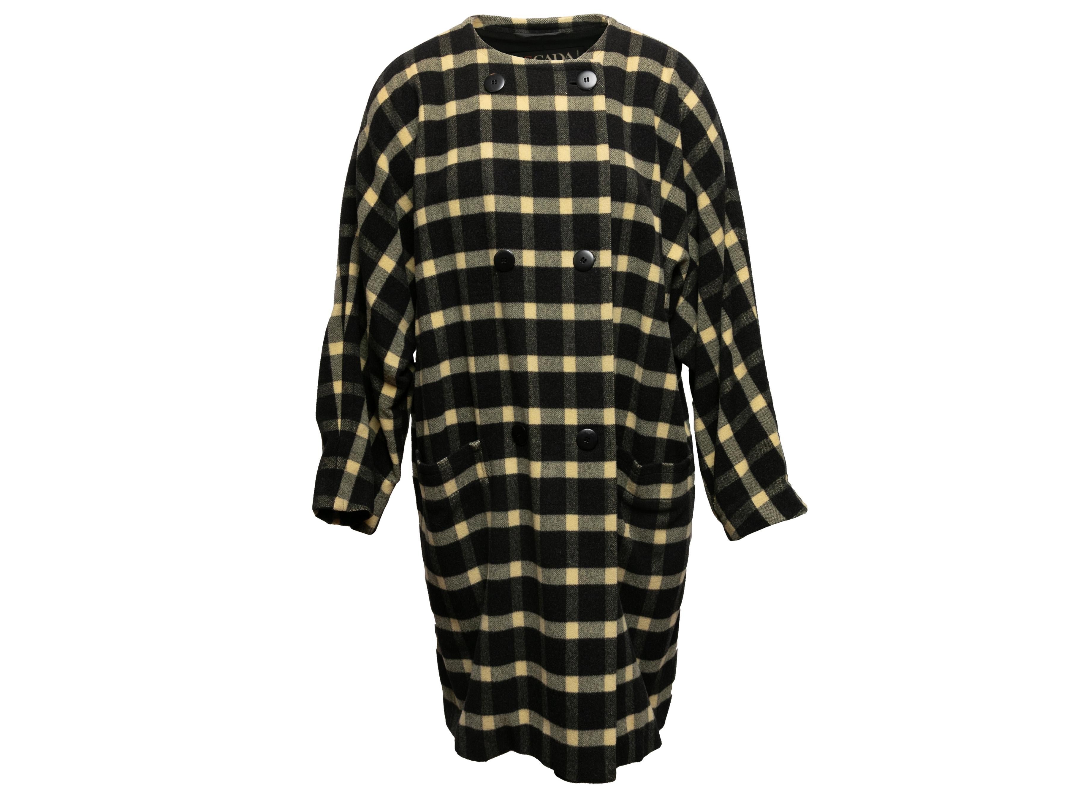 Product Details: Vintage black and light yellow virgin wool plaid collarless coat by Escada. Crew neck. Dual hip pockets. Double-breasted front button closures. 60