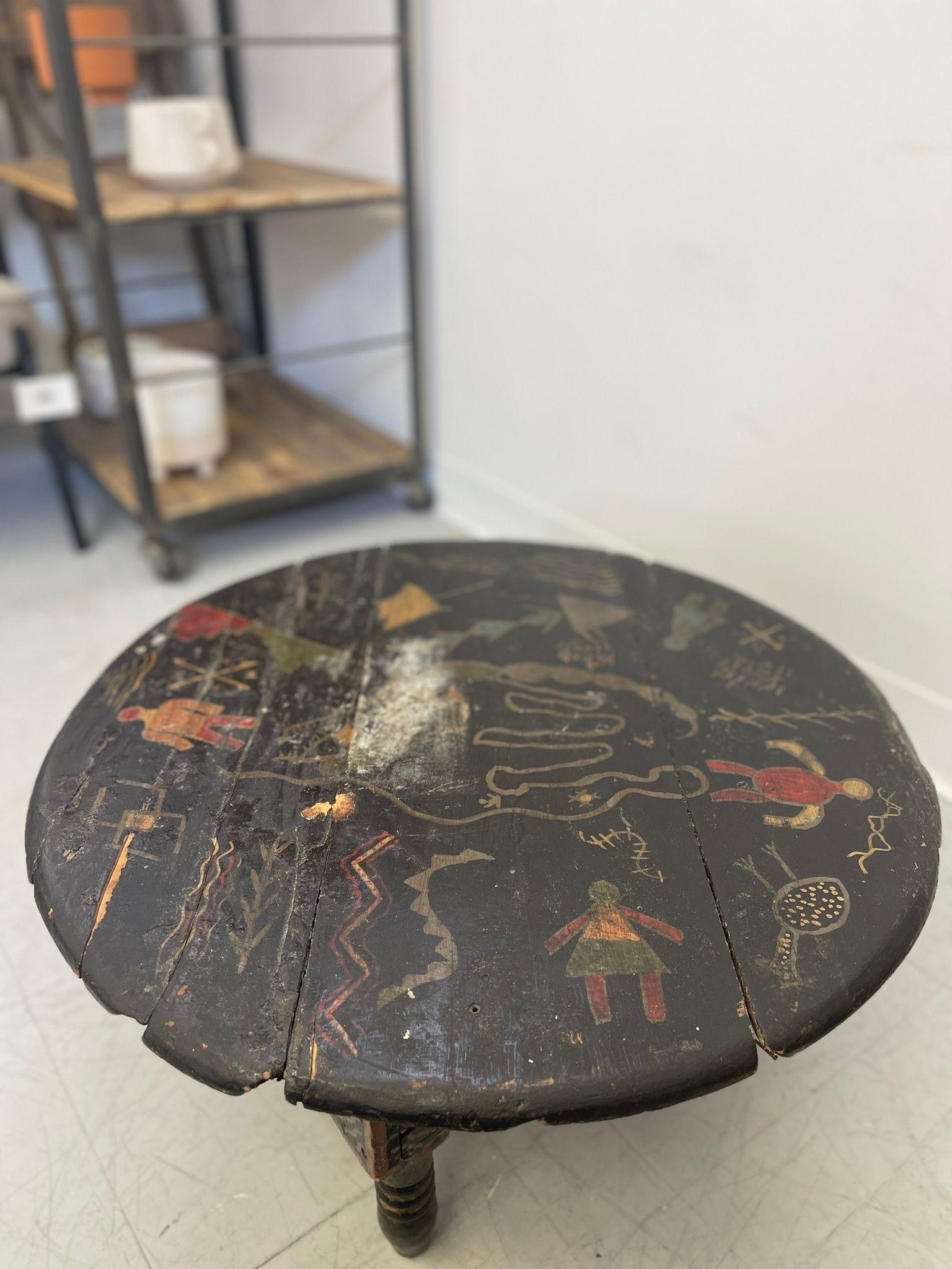 Mid-Century Modern Vintage Black Moroccan Round Table With Primitive Illustrations. For Sale