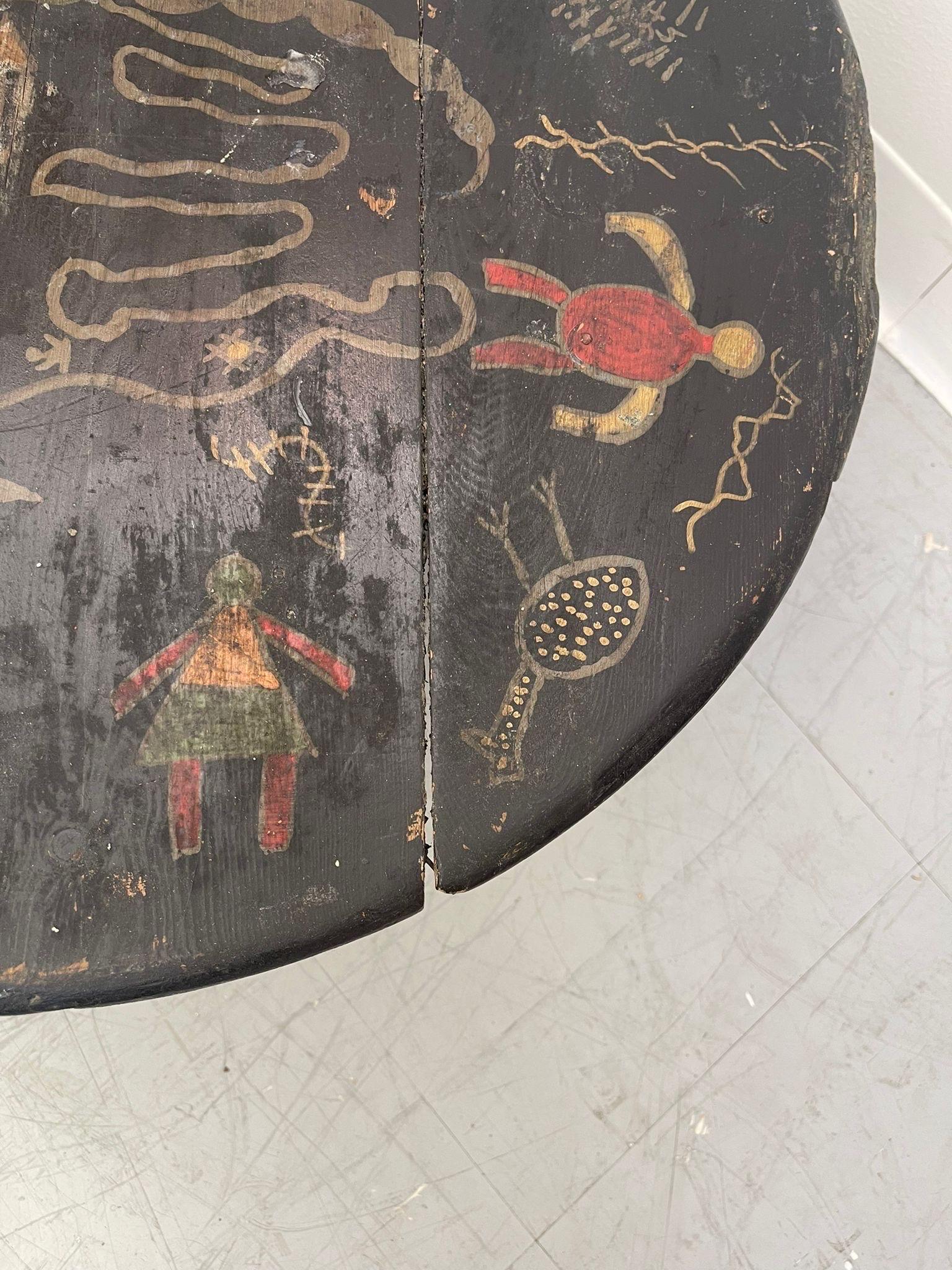 Late 20th Century Vintage Black Moroccan Round Table With Primitive Illustrations. For Sale