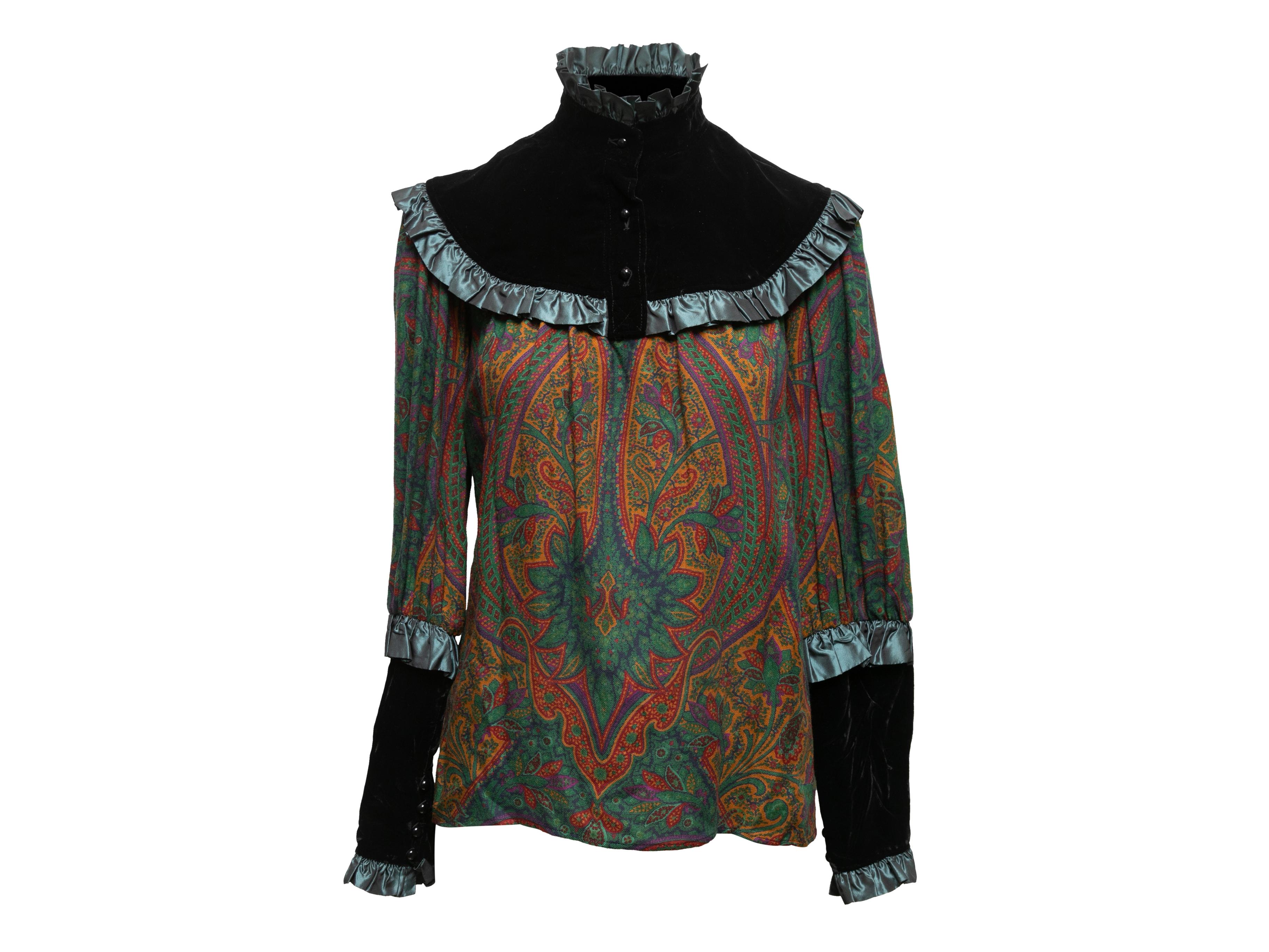 Vintage black and multicolor velvet and paisley long sleeve blouse by Saint Laurent. From the 1976 Russian Collection. Ruffle trim throughout. Stand collar. Front button closures at neck. 36