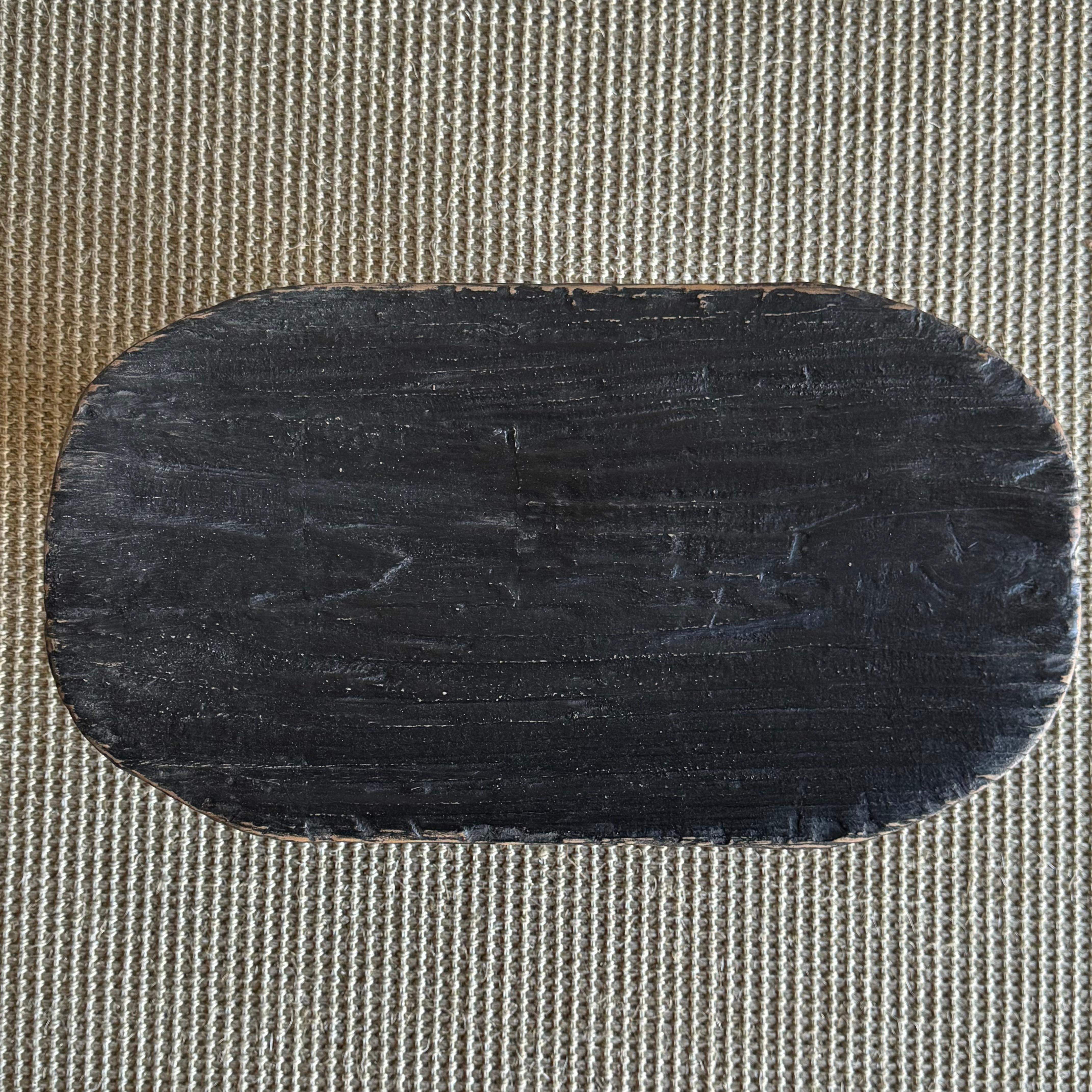 Taburete africano vintage pintado de negro siglo XX en venta