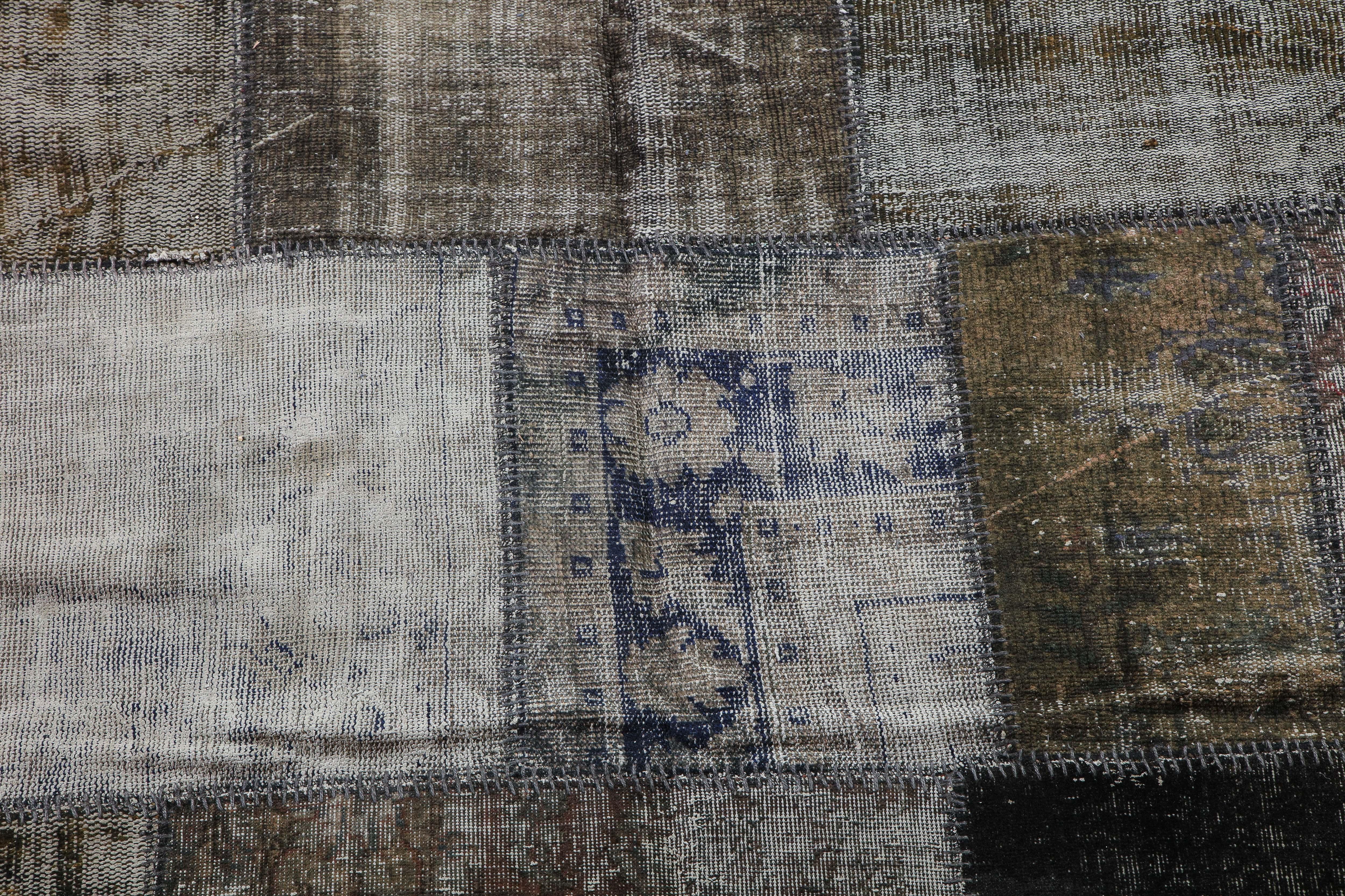 Vintage distressed patchwork rug, circa 1940. These are vintage, hand-knotted Kilim pieces of varying ages, stitched together and cut low with a brown ribbed fabric back, done circa 21st century.