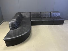 Vintage black patchwork leather modular sofa set by Laauser, 1970s