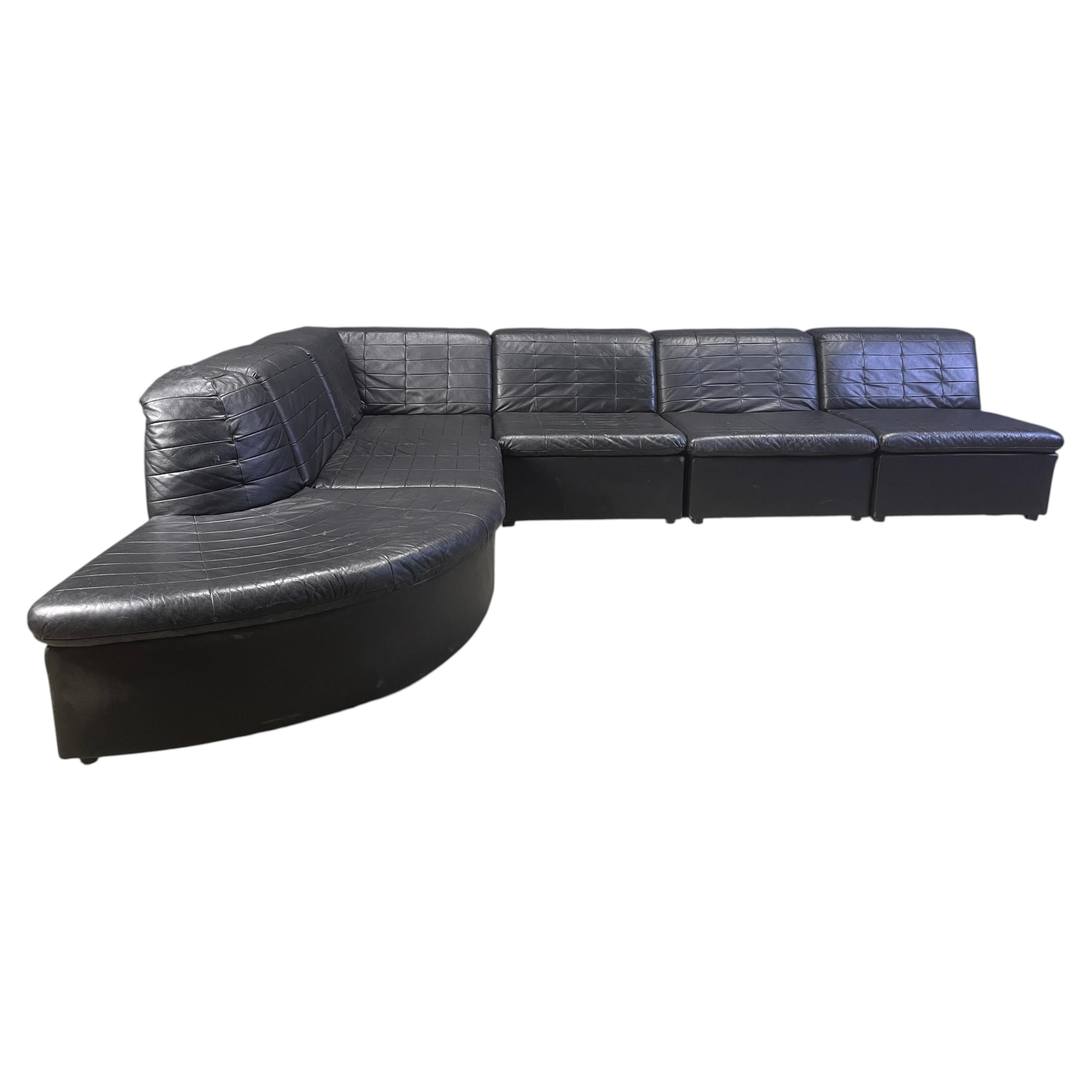 Vintage black patchwork leather modular sofa set by Laauser, 1970s