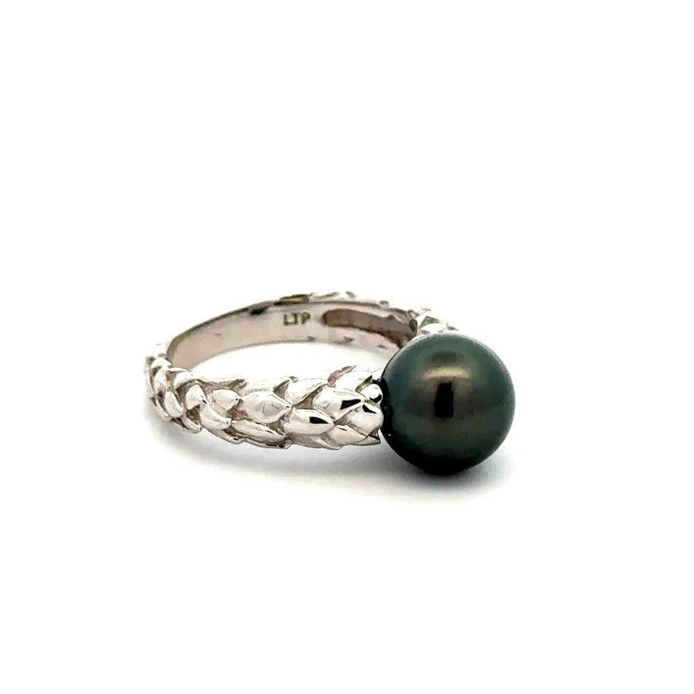 Simply Beautiful! Stylish Finely detailed Black Pearl Gold Ring. Centering an 8.6mm Black Pearl. Hand crafted Wreath Shank 14K White Gold mounting. Ring size 5.25, we offer ring resizing. More Beautiful in Real time! Classic and