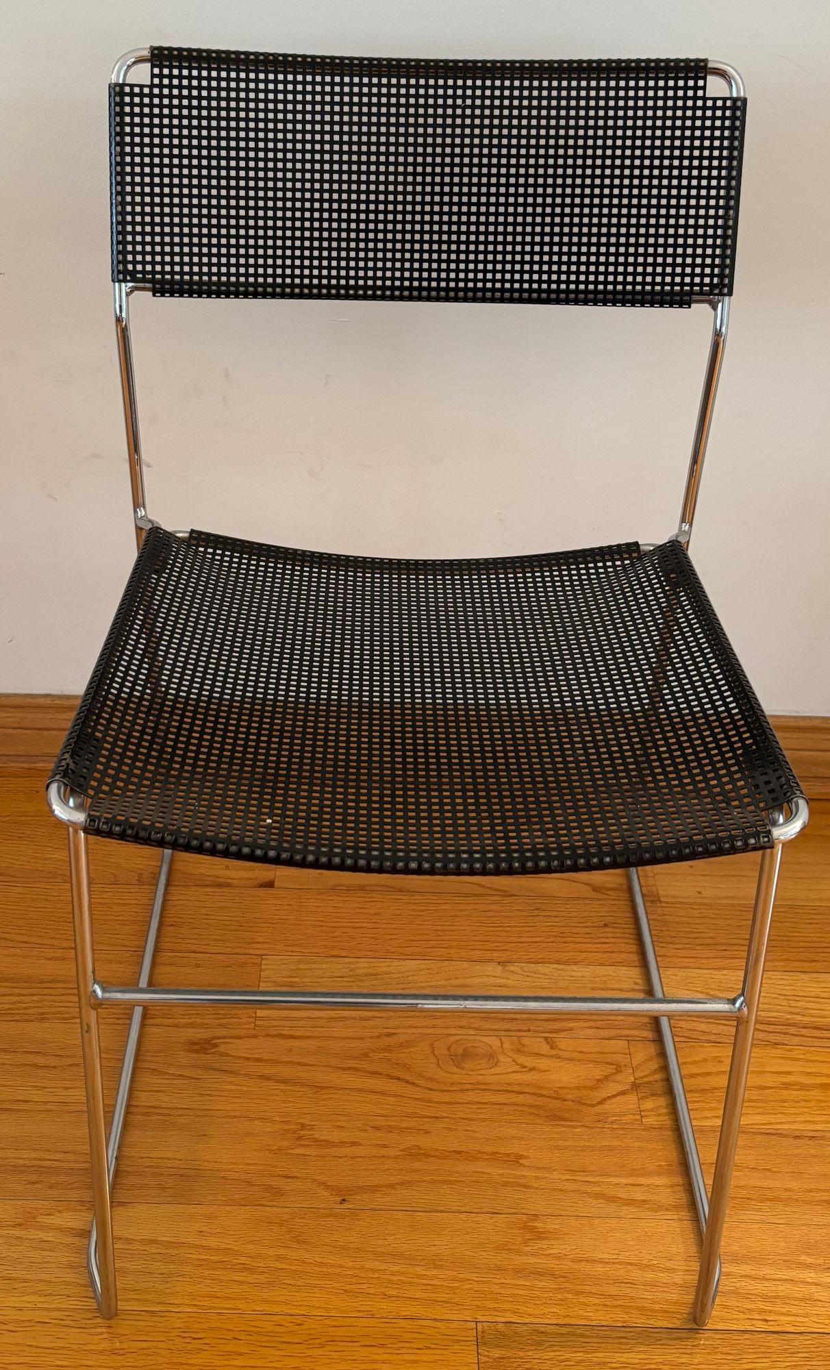 Vintage Black Perforated Metal and Chrome Chair attributed to Niels Jorgen Haugesen for Magis.
Made of chrome-plated steel rods and black enameled perforated steel back and seat.
Attributed to Danish Designer Niels Jorgen Haugesen in the 1970s and