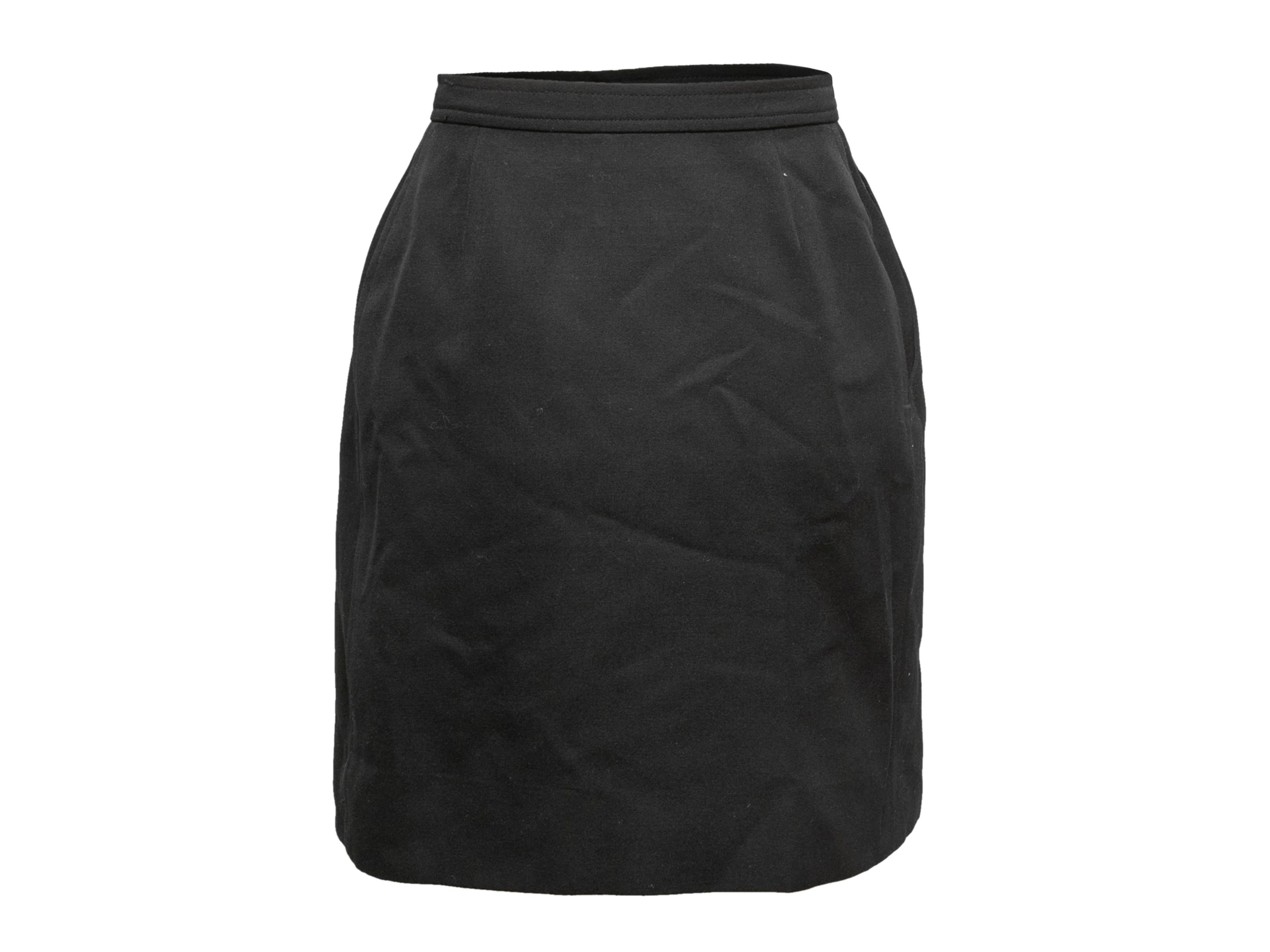 Vintage black wool wrap skirt by Saint Laurent. Hip pocket. Side closure. Designer size 34. 24