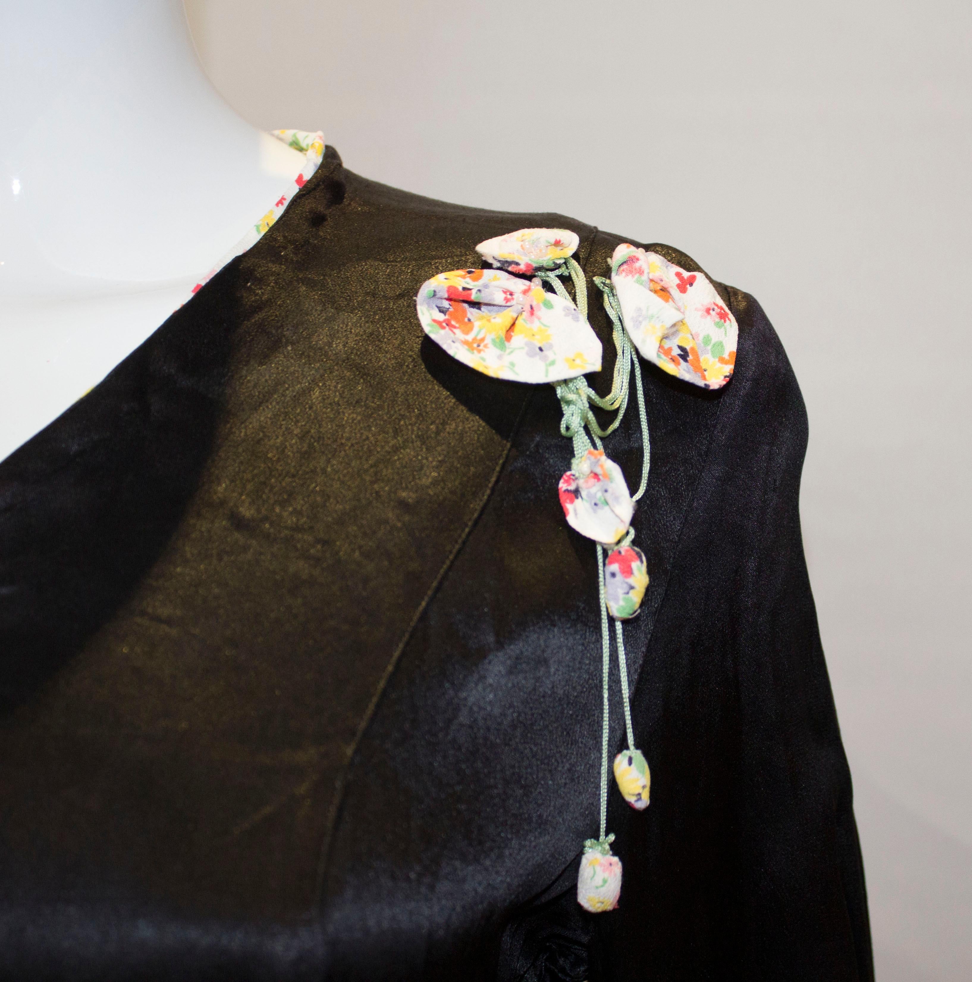 Vintage Black Satin 1920s dress with floral trim In Good Condition For Sale In London, GB