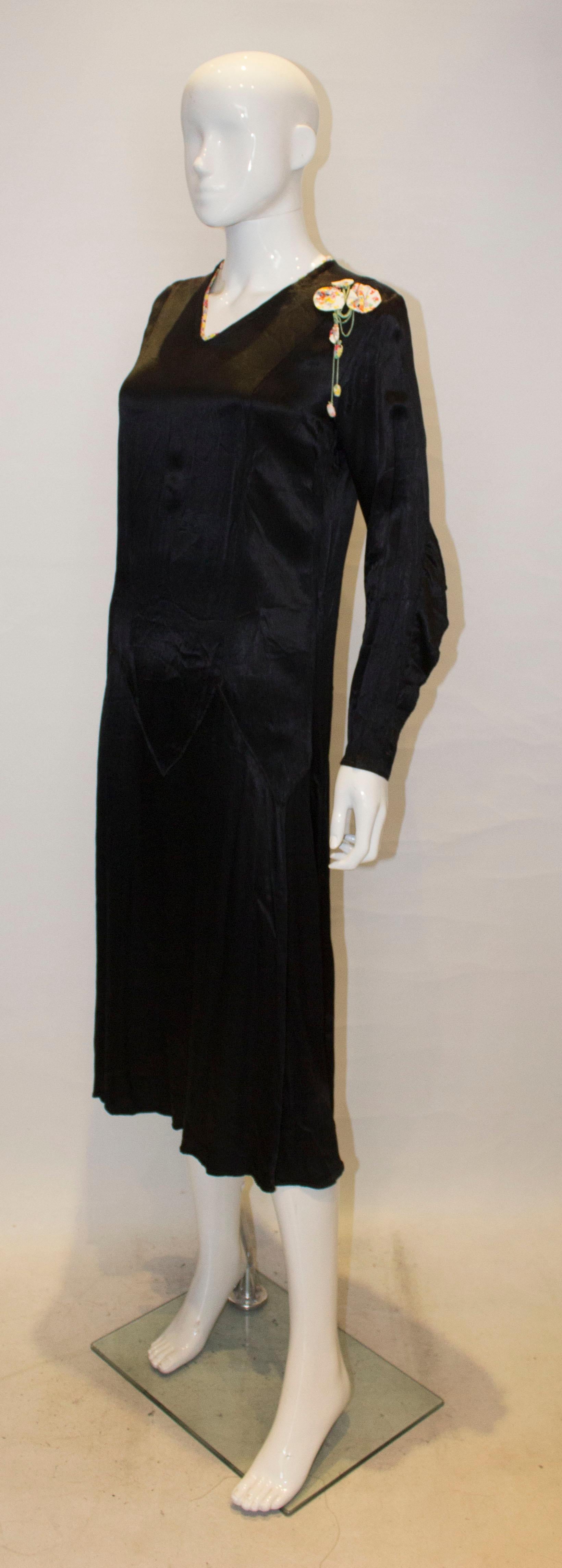 Women's Vintage Black Satin 1920s dress with floral trim For Sale