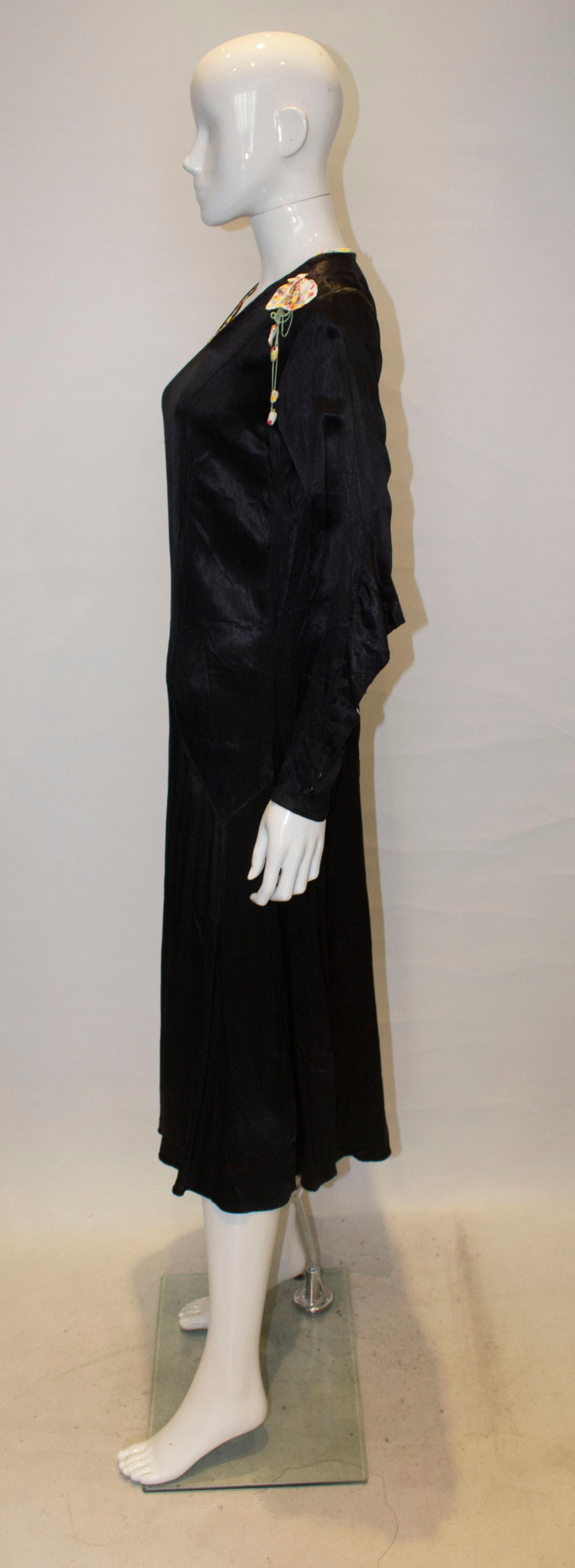 Vintage Black Satin 1920s dress with floral trim For Sale 2