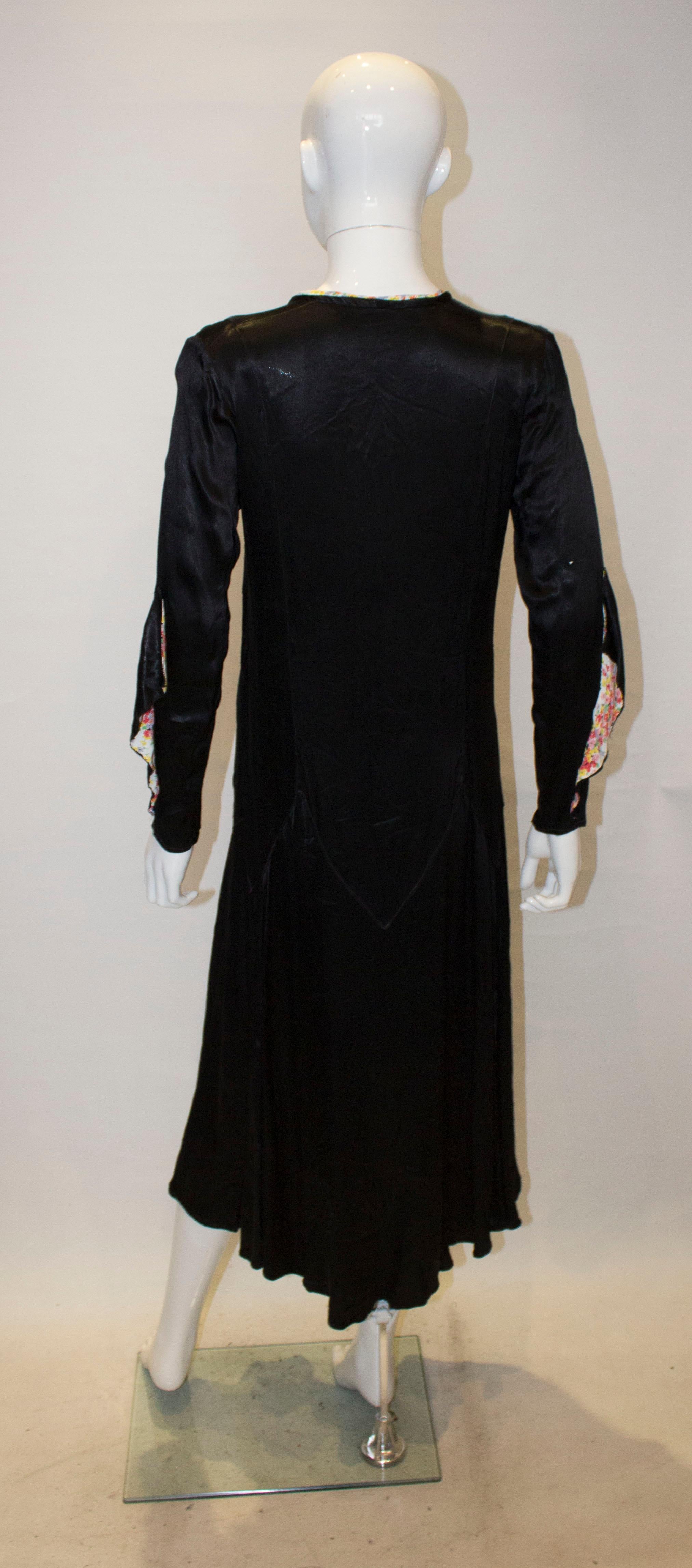 Vintage Black Satin 1920s dress with floral trim For Sale 4