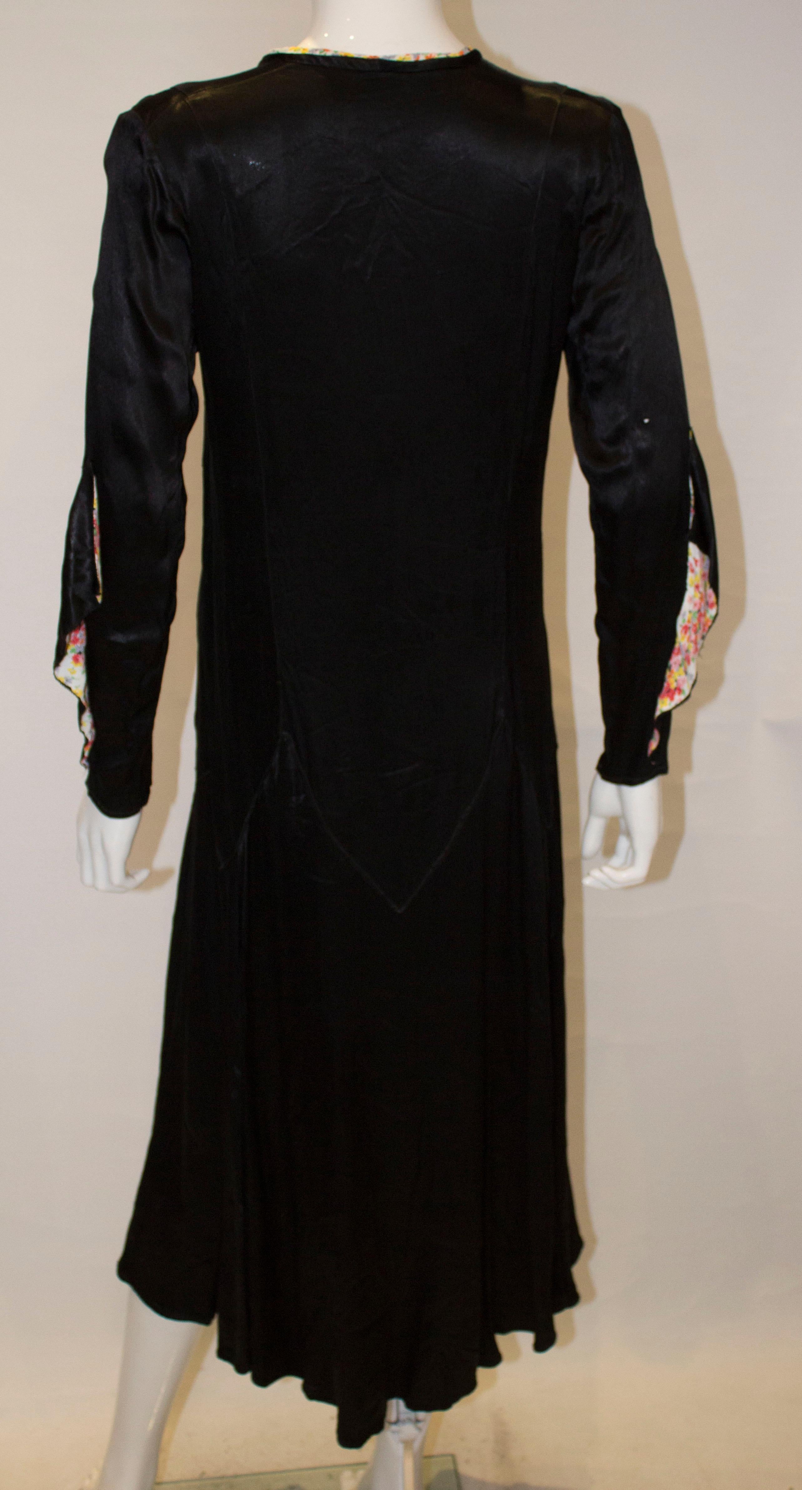 Vintage Black Satin 1920s dress with floral trim For Sale 5