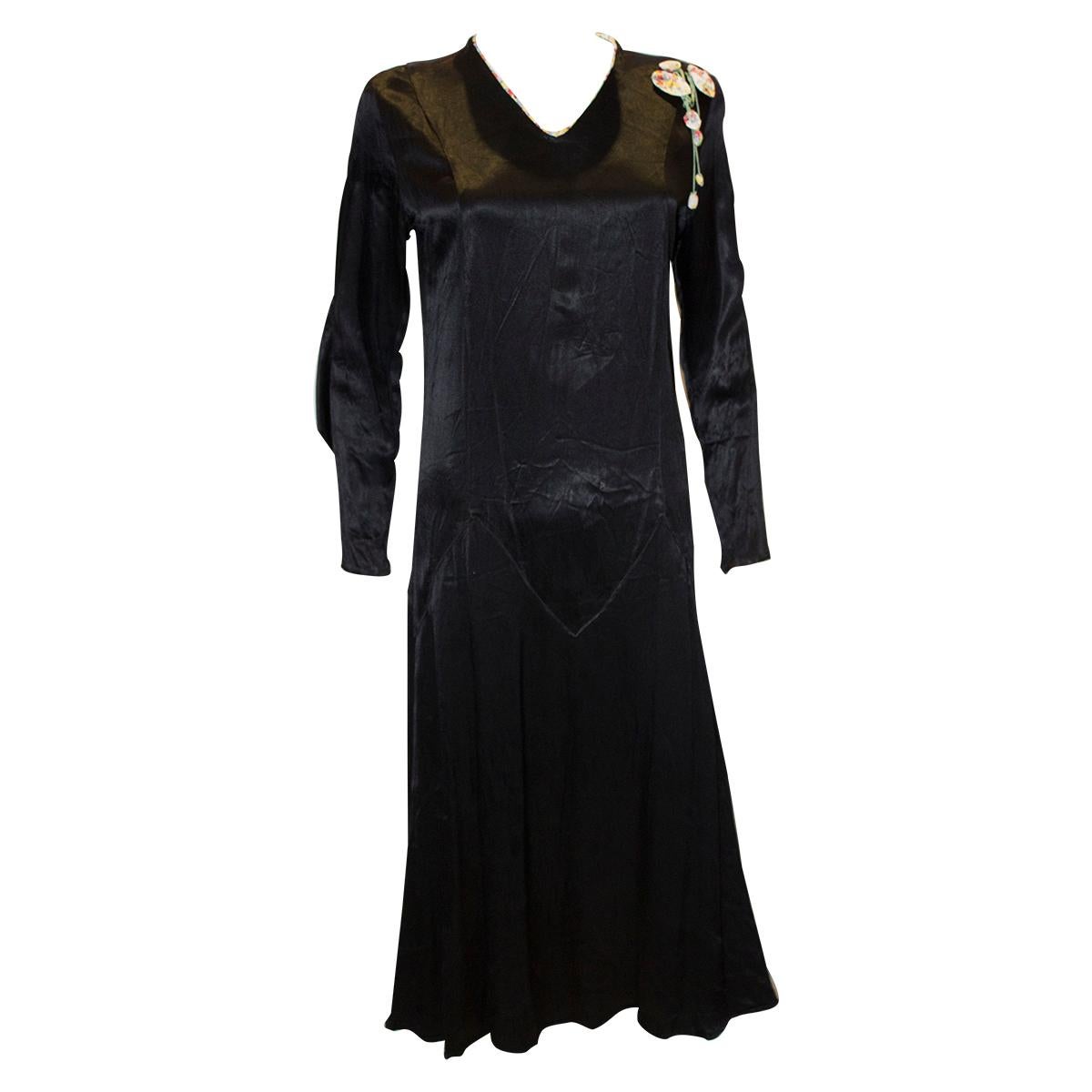 Vintage Black Satin 1920s dress with floral trim For Sale
