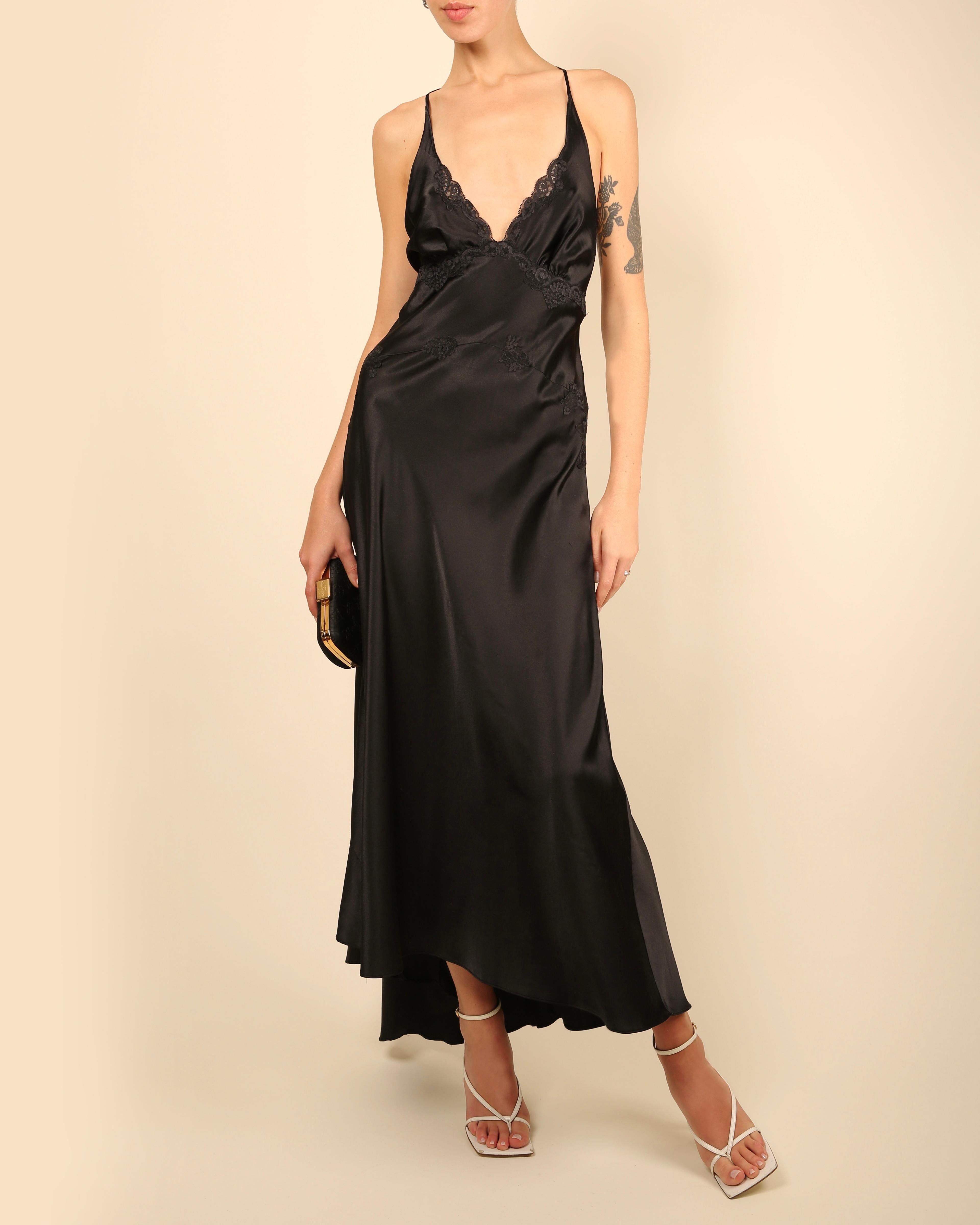 LOVE LALI Vintage

A beautiful satin vintage slip style maxi dress in black
Lace inserts and trim
Adjustable straps
Cut out back with ties

Composition:
No composition label - estimated to be satin (100% polyester)

Size:
No size label - estimated