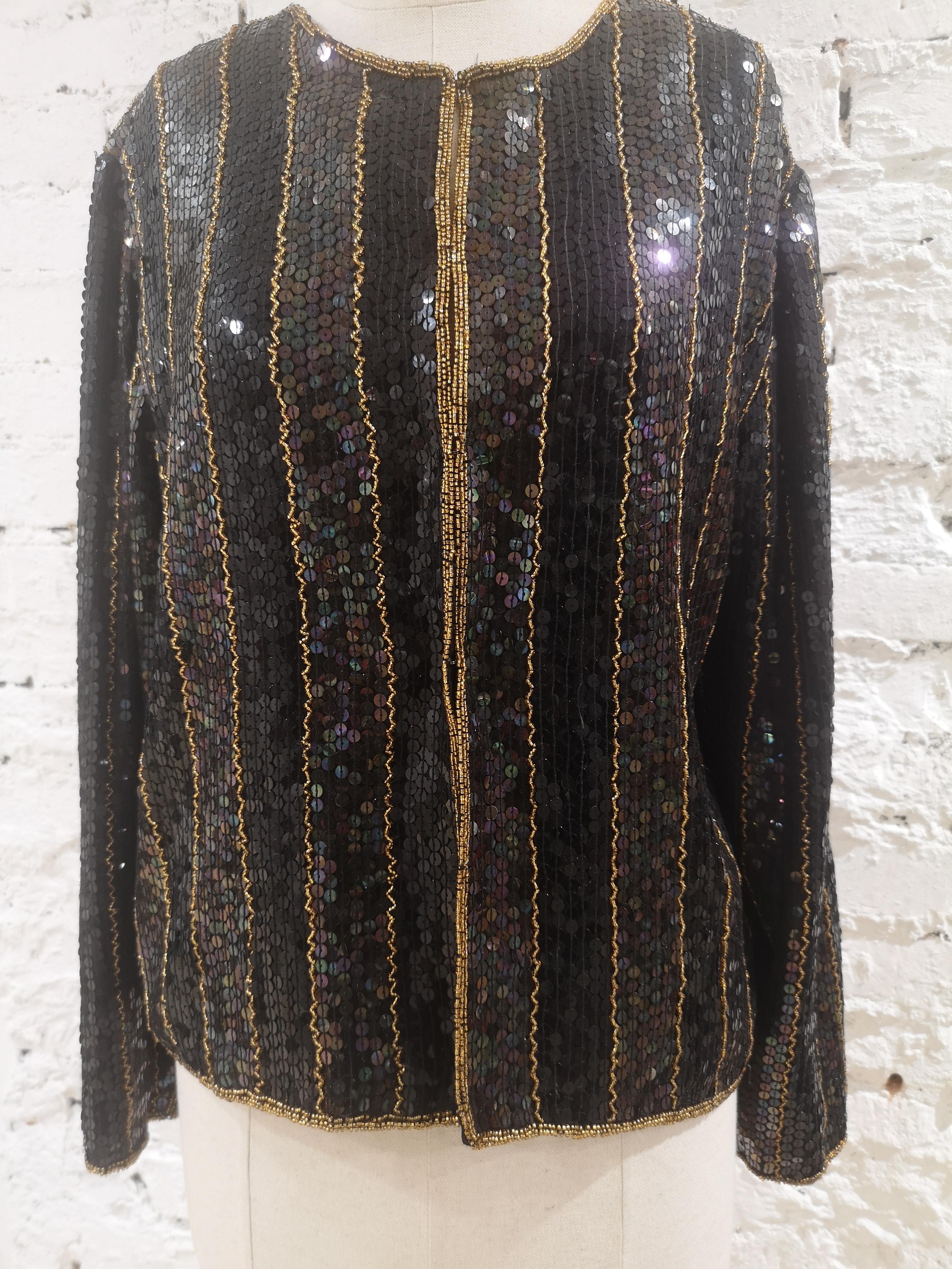 Vintage black sequins gold beads jacket
totally made in italy in size M
total lenght 58 cm
shoulder to hem 58 cm