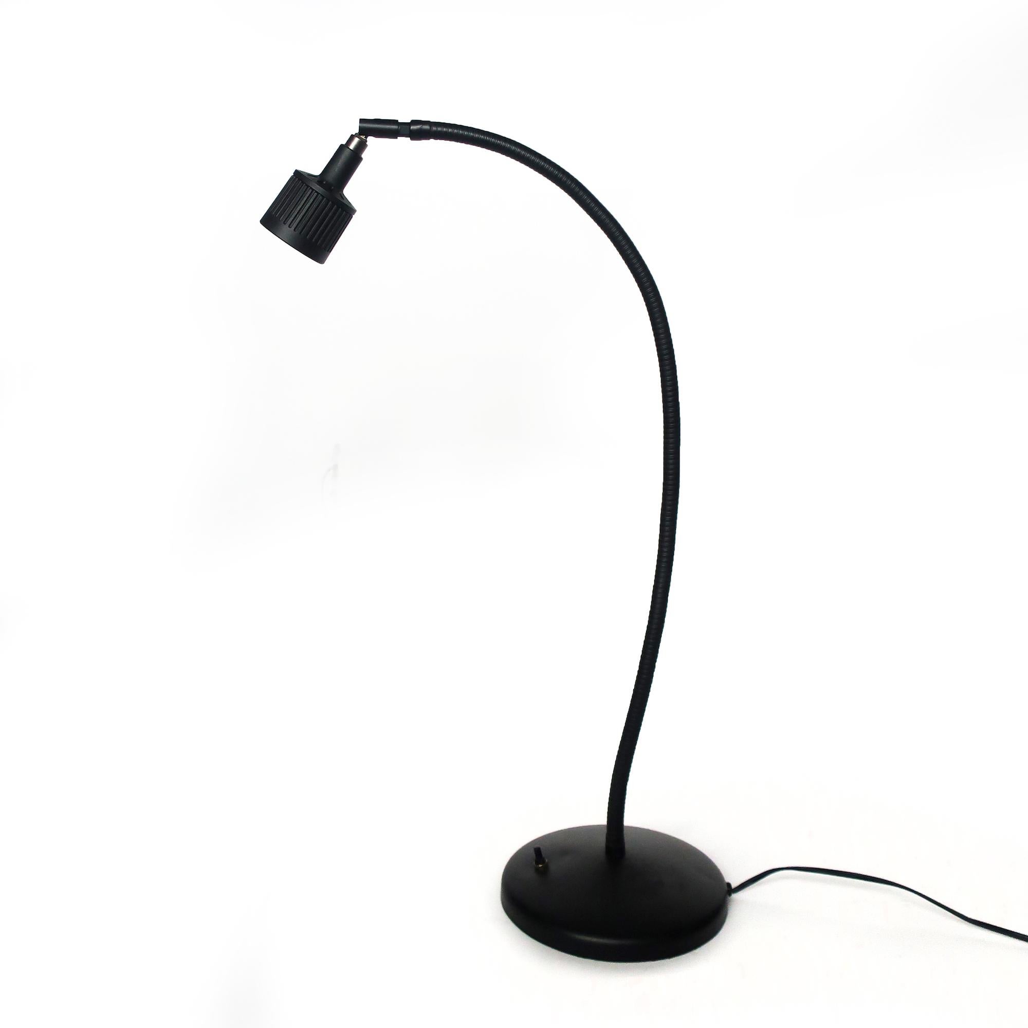 A vintage black Sunnex gooseneck desk lamp that is perfect for a Minimalist, Mid-Century Modern, or postmodern 1980s inspired home or office. Round metal base, on/off switch on the base, and gooseneck stem. 

In good vintage condition with wear