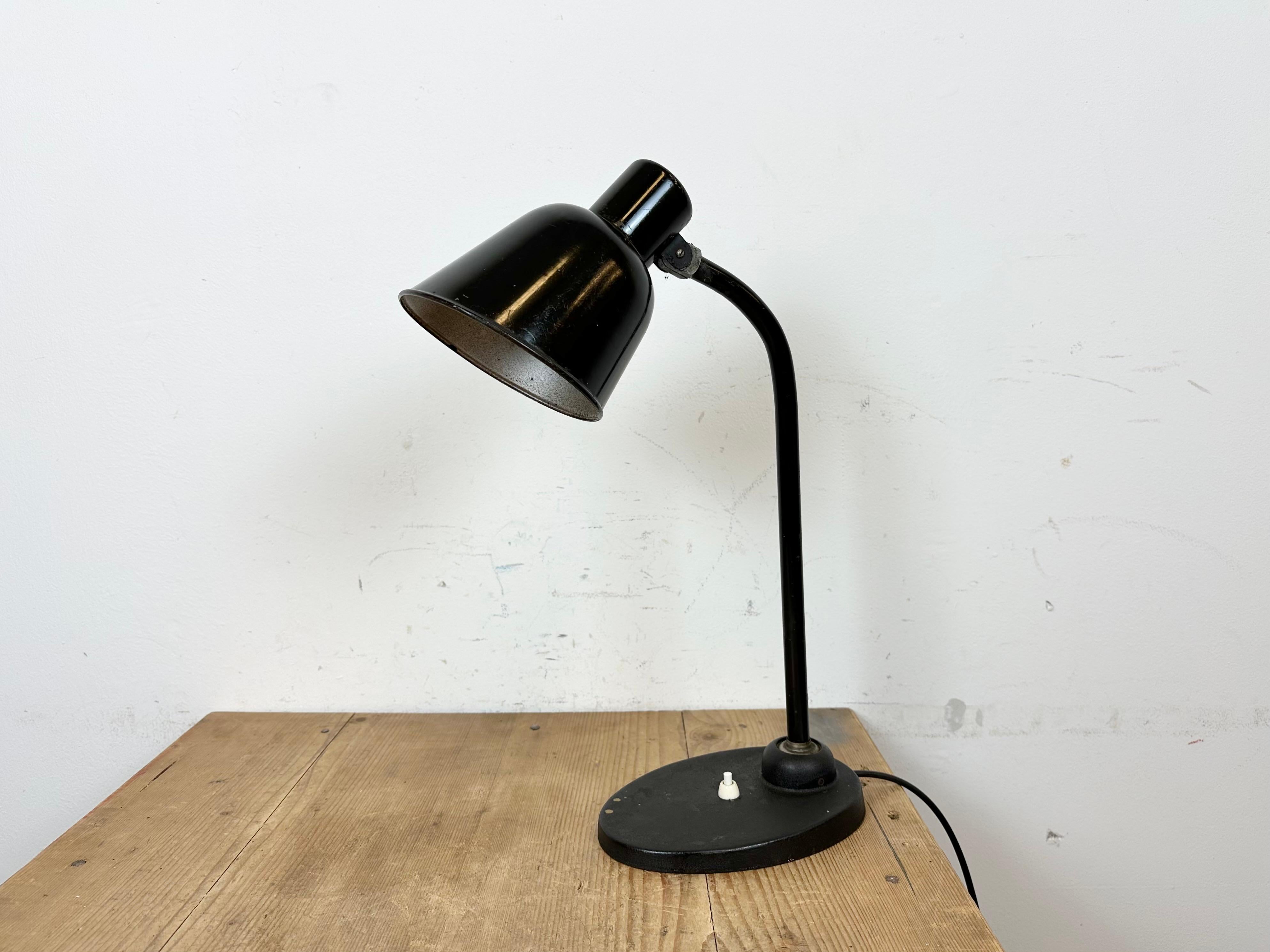 Vintage 1930s BUR Model 2700 table lamp designed by famous BAUHAUS designer Christian Dell For BUR Bunte & Remmler Lighting Company Germany.
It features a black iron body with adjustable arm and shade. The socket requires standard E 27/ E 26 light