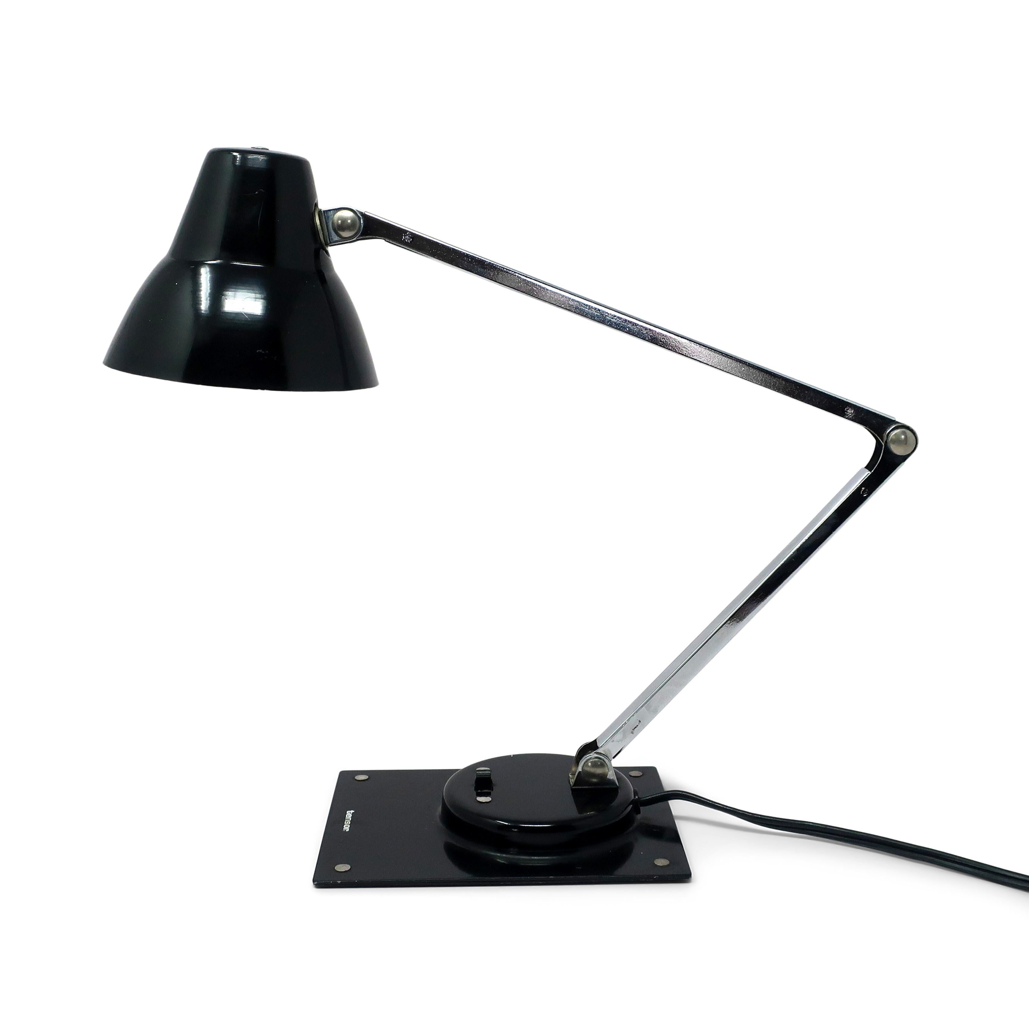 A perfect mid-century modern Tensor IL 400 articulating desk lamp.  Black base and shade, chrome stem, and switch on the base.  In good vintage condition.

4