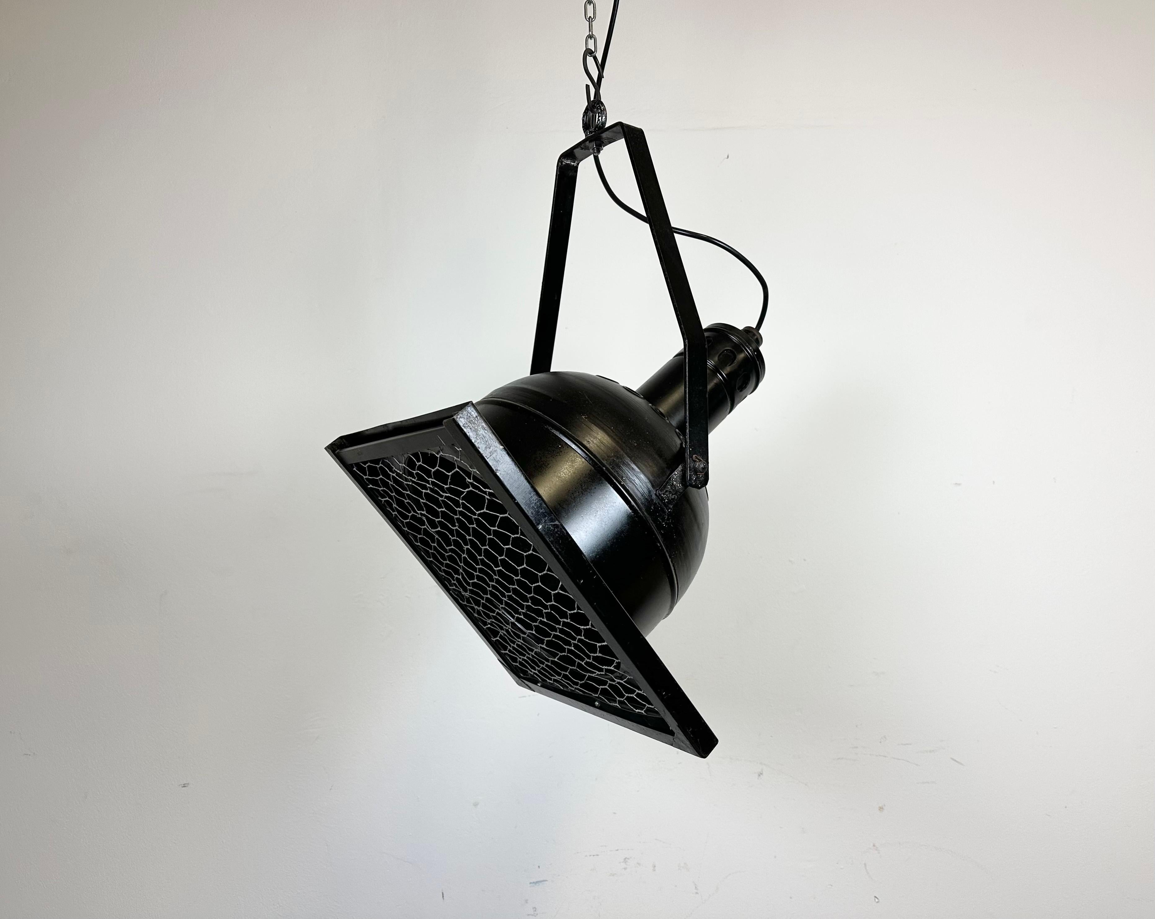 - Vintage theatre spotlight made by in former Czechoslovakia during the 1950s 
- It features a black metal body with silver interior and iron grid.
- Adjustable angle
- The porcelain socket requires E27/ E26 lightbulbs 
- New wire
-The height of the