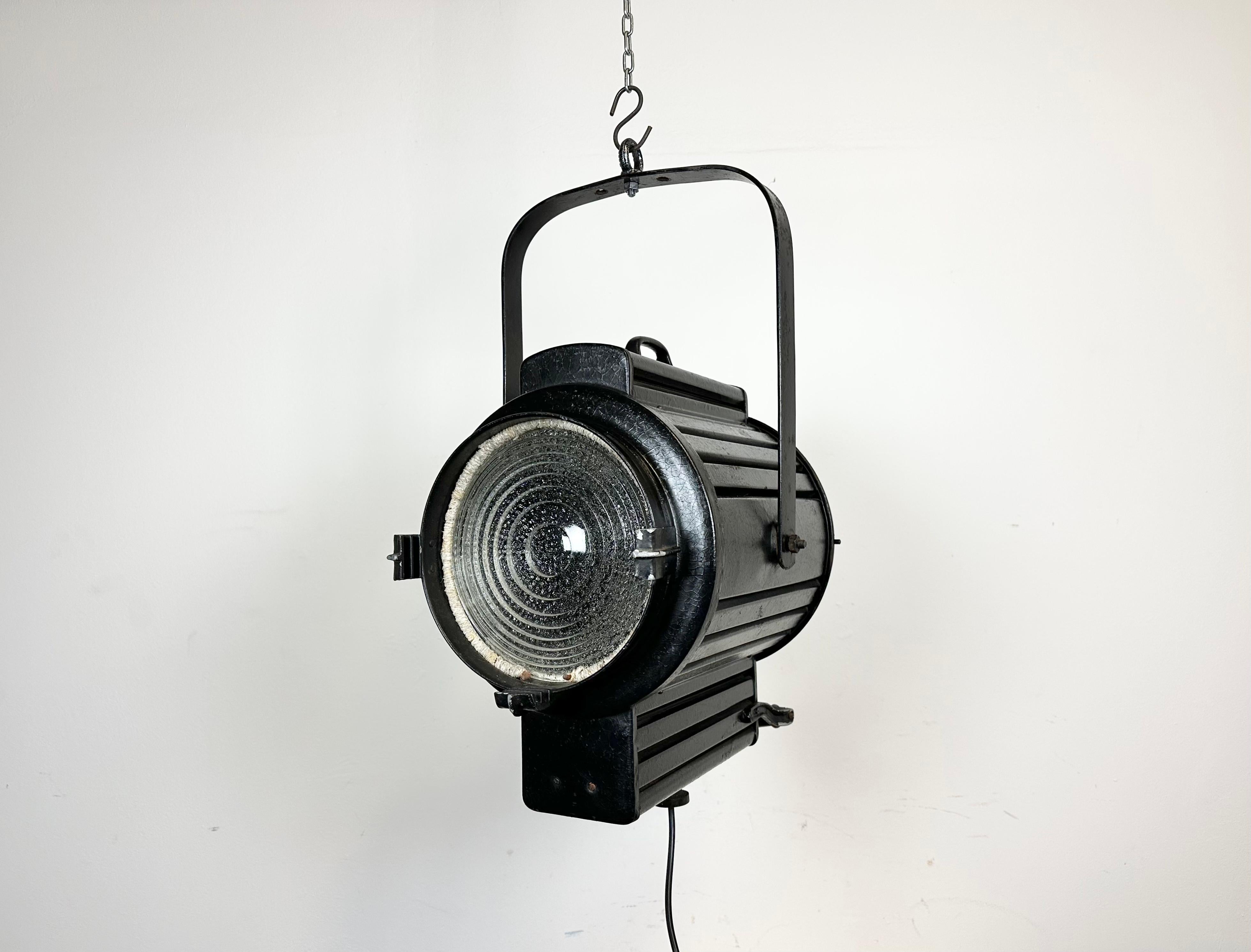 - Vintage theatre spotlight made in former Czechoslovakia during the 1960s 
- It features a black metal body and clear glass lens cover
- The porcelain socket requires E27/ E26 lightbulbs 
- New wire
-The height of the spotlight is 40 cm. With