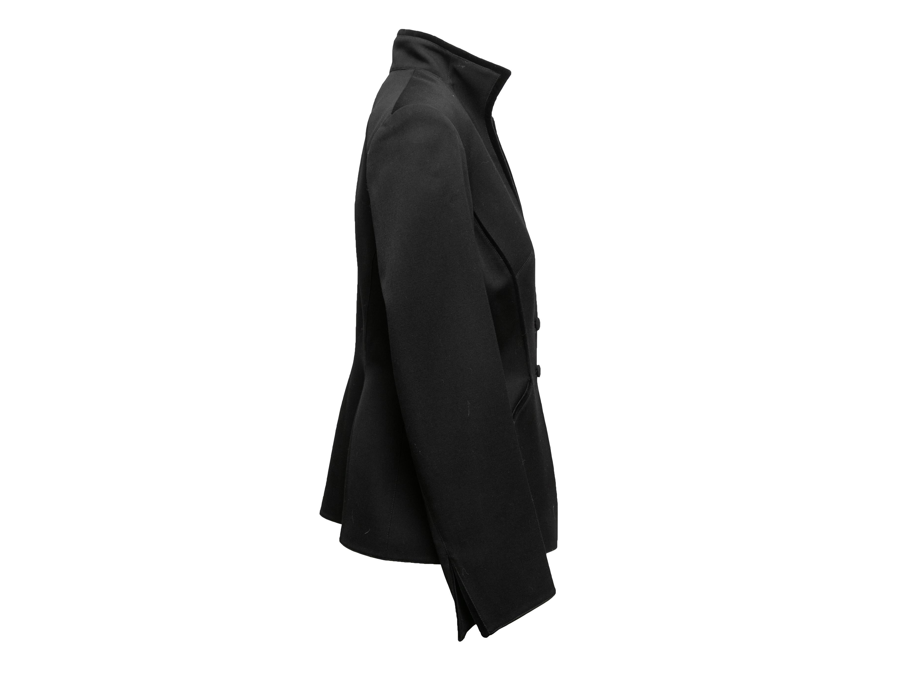 Vintage black V-neck blazer by Thierry Mugler. Velvet trim throughout. Pointed collar. Button closures at front. 38