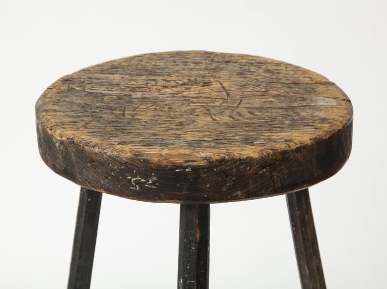 North American Vintage Black Tripod Stool with Rustic Wood Top For Sale