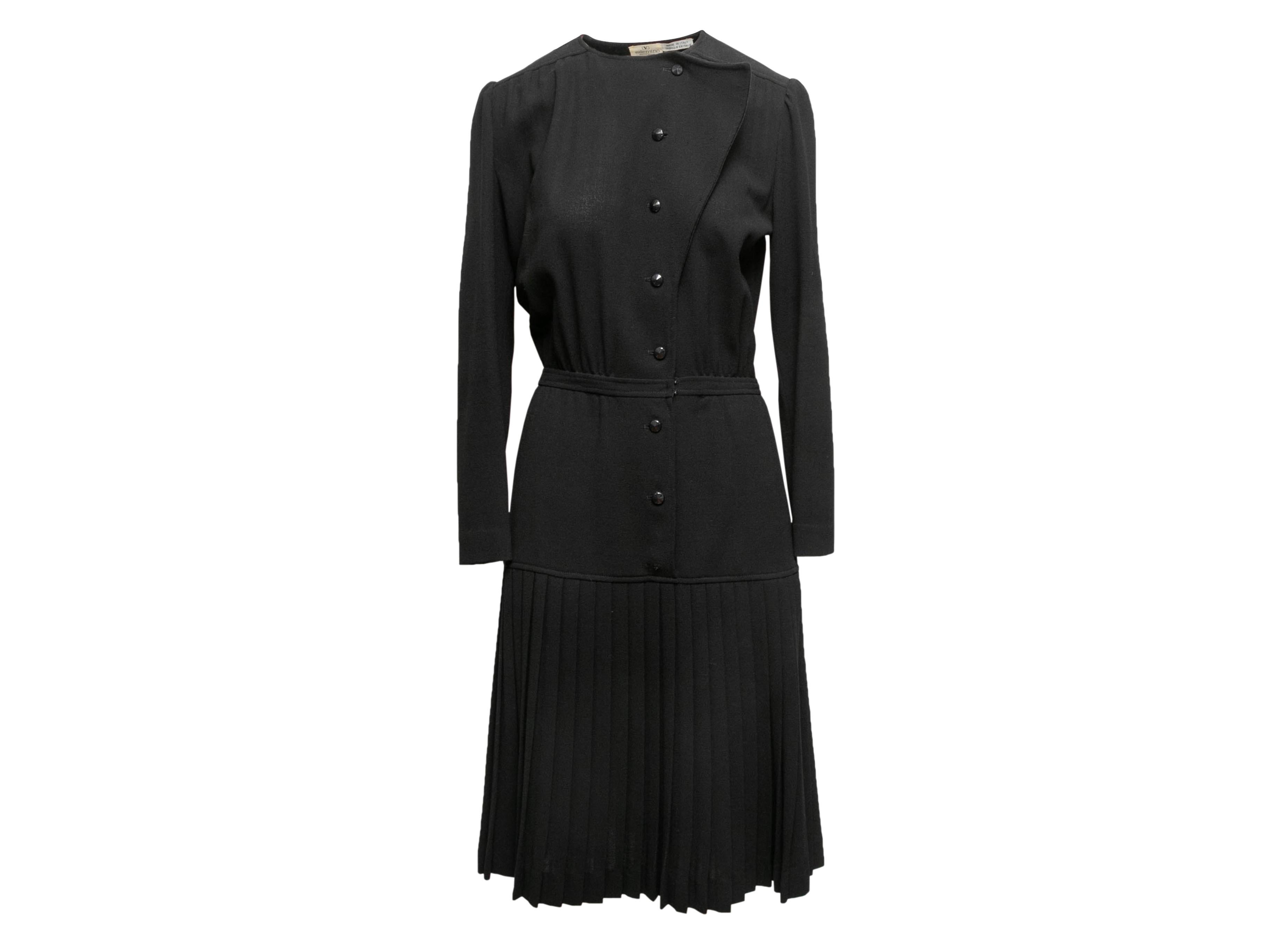 Vintage black pleated long sleeve dress by Valentino Boutique. Crew neck. Button closures at front. 42