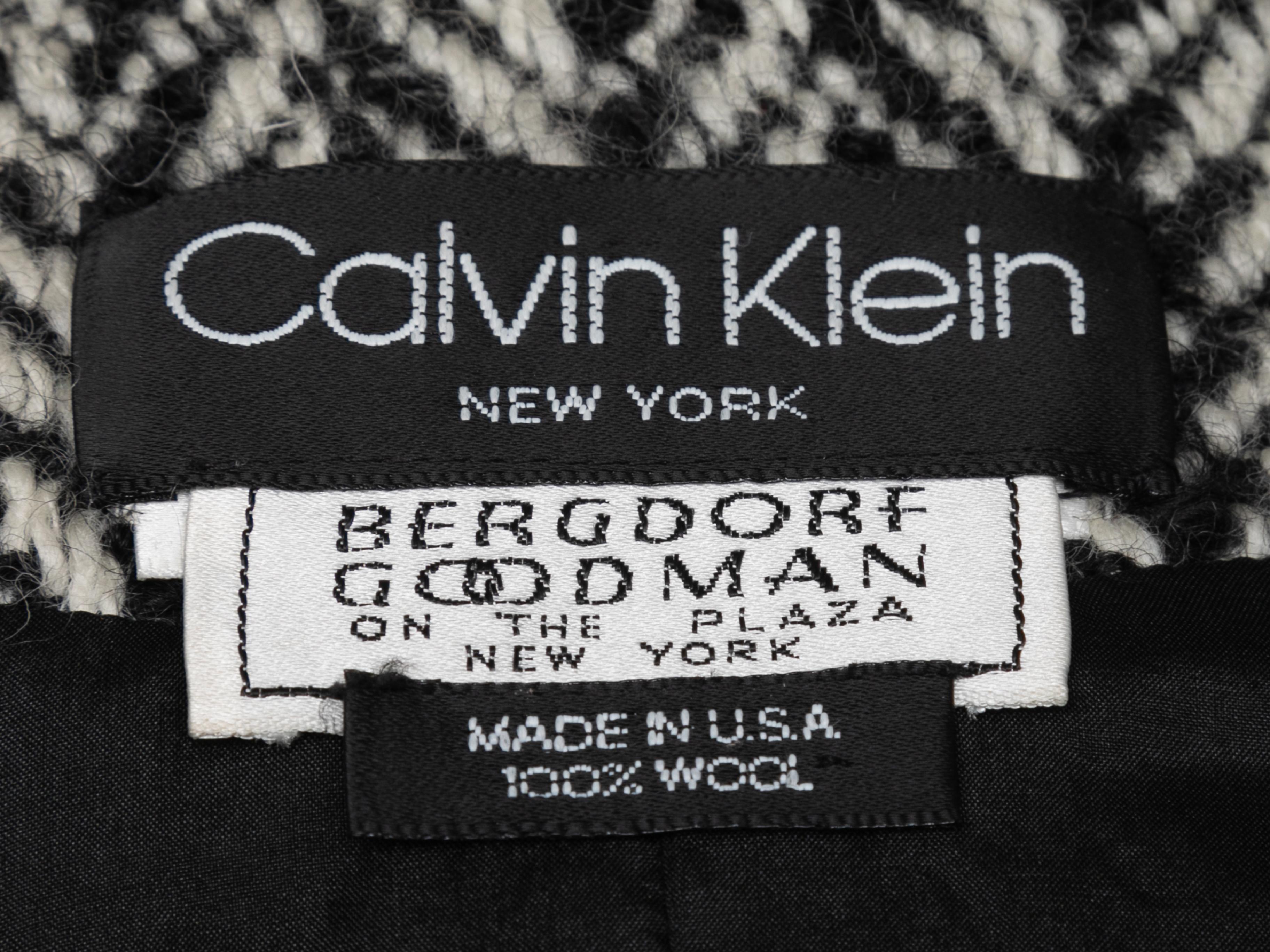 Vintage black and white wool herringbone jacket by Calvin Klein. Crew neck. Double-breasted button closures at front. 36