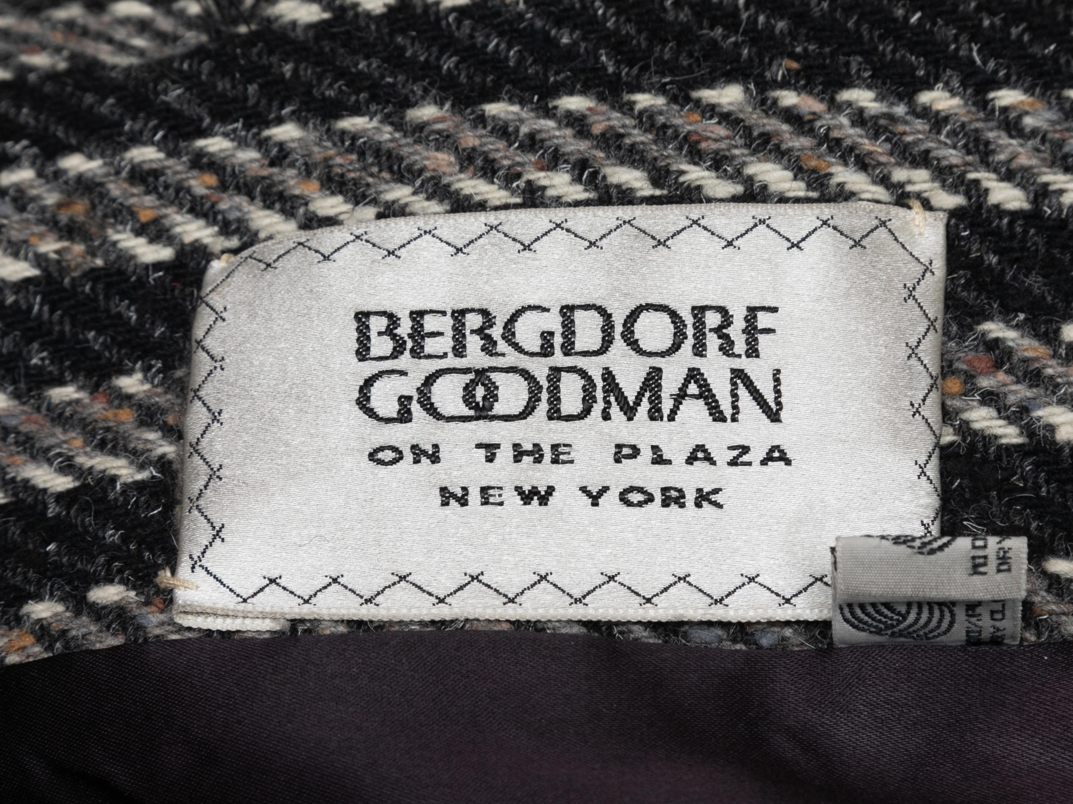 Vintage black and white striped wool coat by Pauline Trigere for Bergdorf Goodman. Crew neck. Button closures at center front. 36