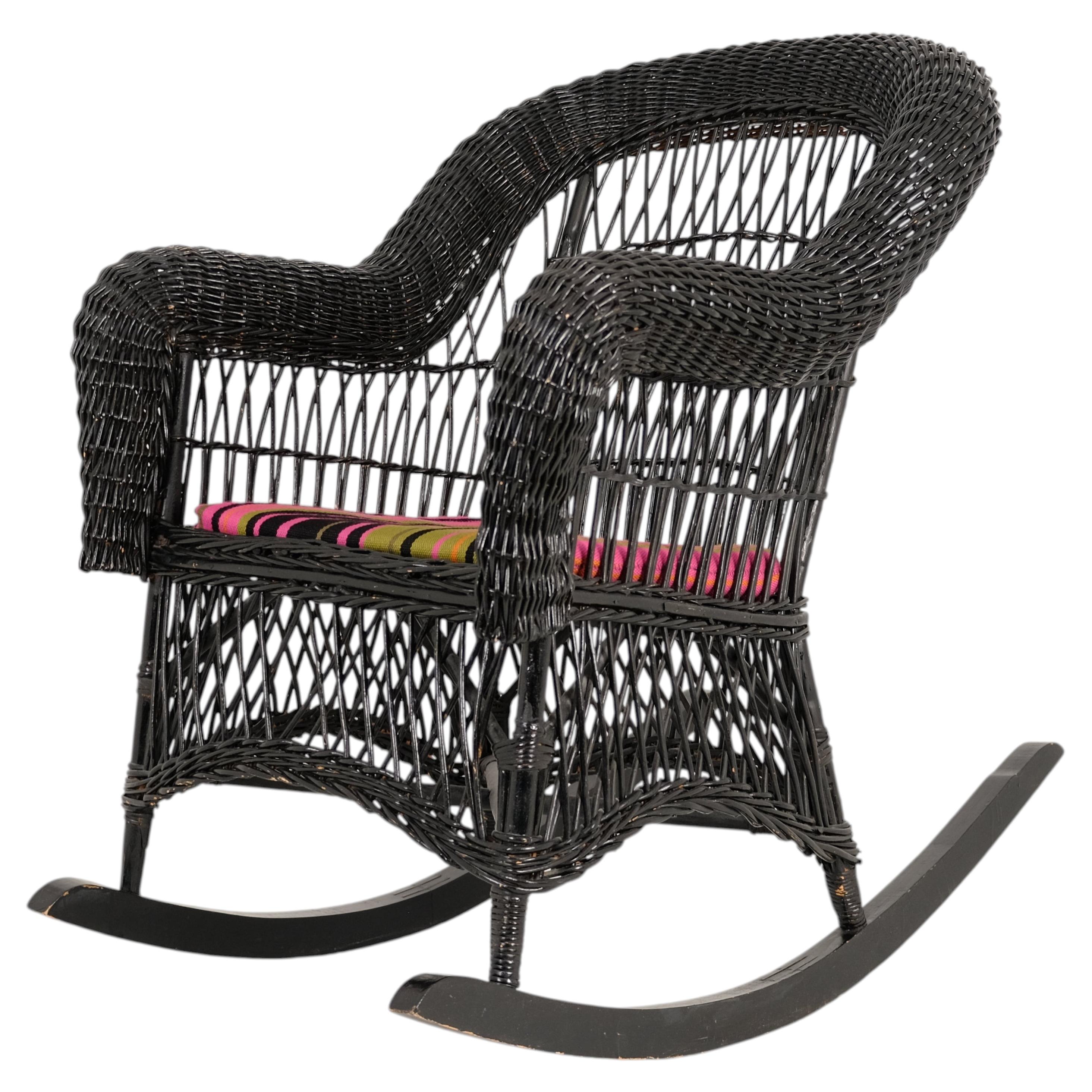Vintage Black Wicker Rocking Chair with Colourful Cushion For Sale
