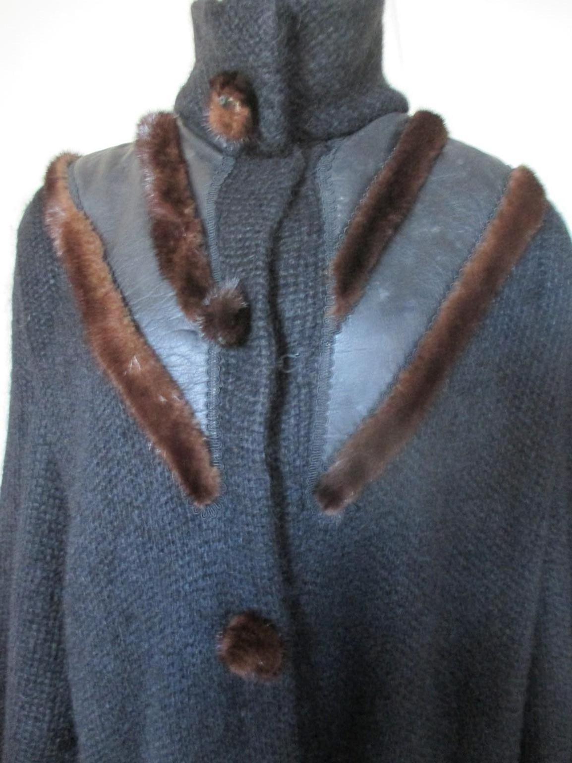 We offer more vintage fur items, view our frontstore

Fabulous original vintage 80/90s mohair wool vest/coat embroidered with brown mink fur, black leather with 3 closinghooks, 1 pressbutton at the collar and 2 pockets.
Fully lined.

Size fits as