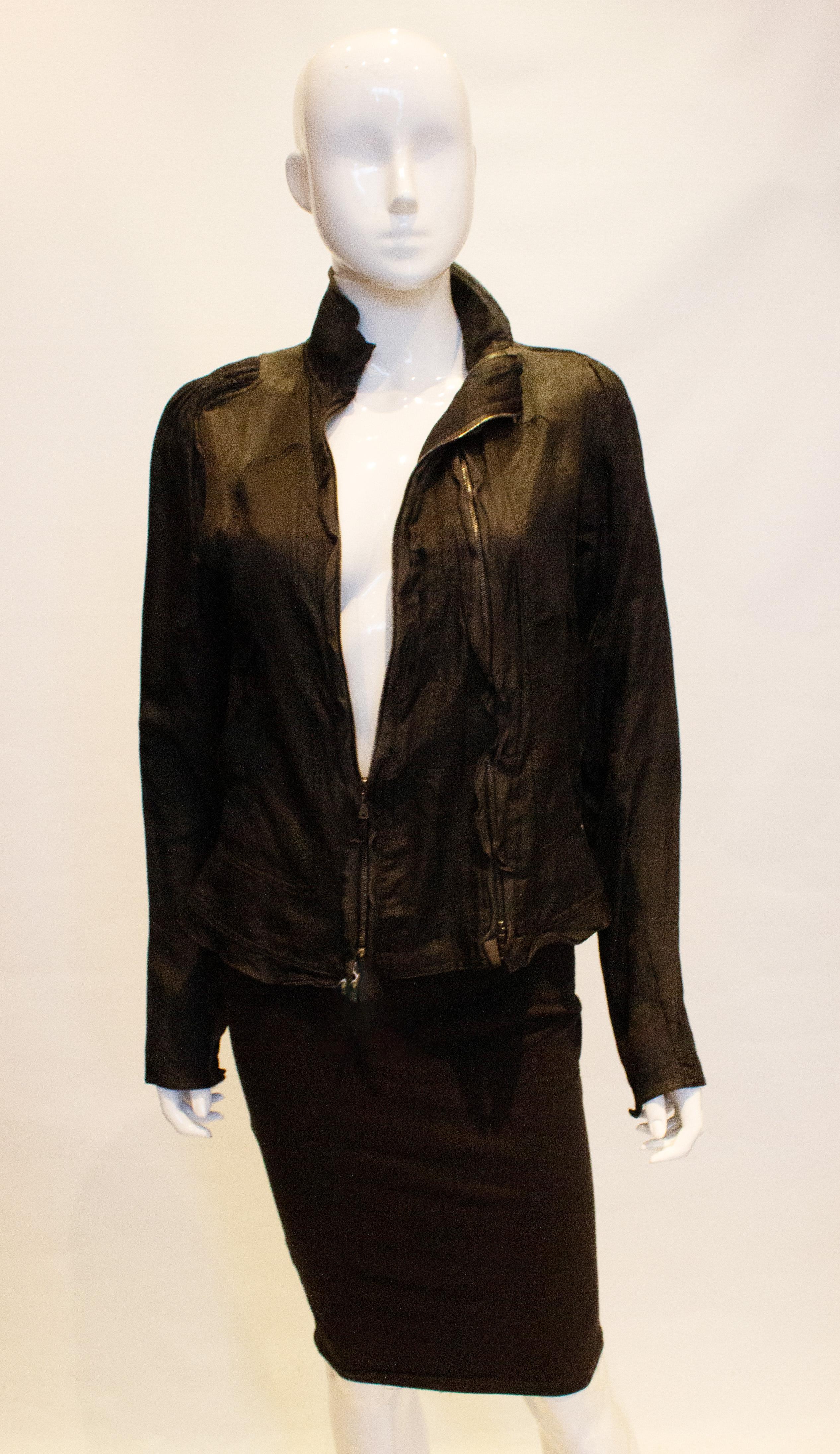 A chic vintage jacket by Yves Saint Laurent. The jacket has an unusual double zip opening at the front,  with zip detail on the sleave and gathering on the shoulder.
Measurements: Bust 37'', length 23''