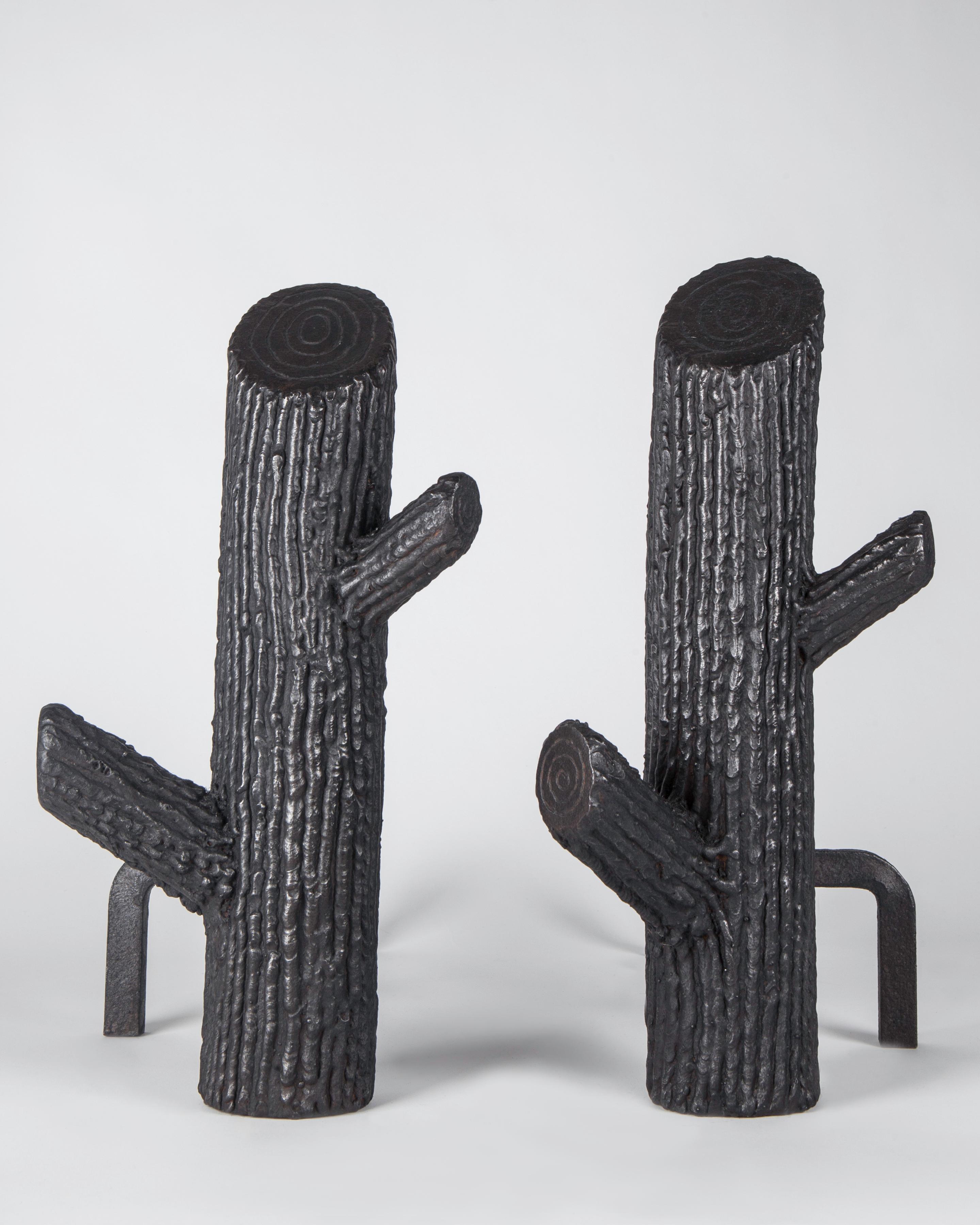 AFP0636
A pair of vintage blackened steel andirons in the form of tree trunks or cacti with two branches. The richly textured surface created by a clever method of laying down individual beads of weld to simulate tree bark.

Dimensions:
Overall: