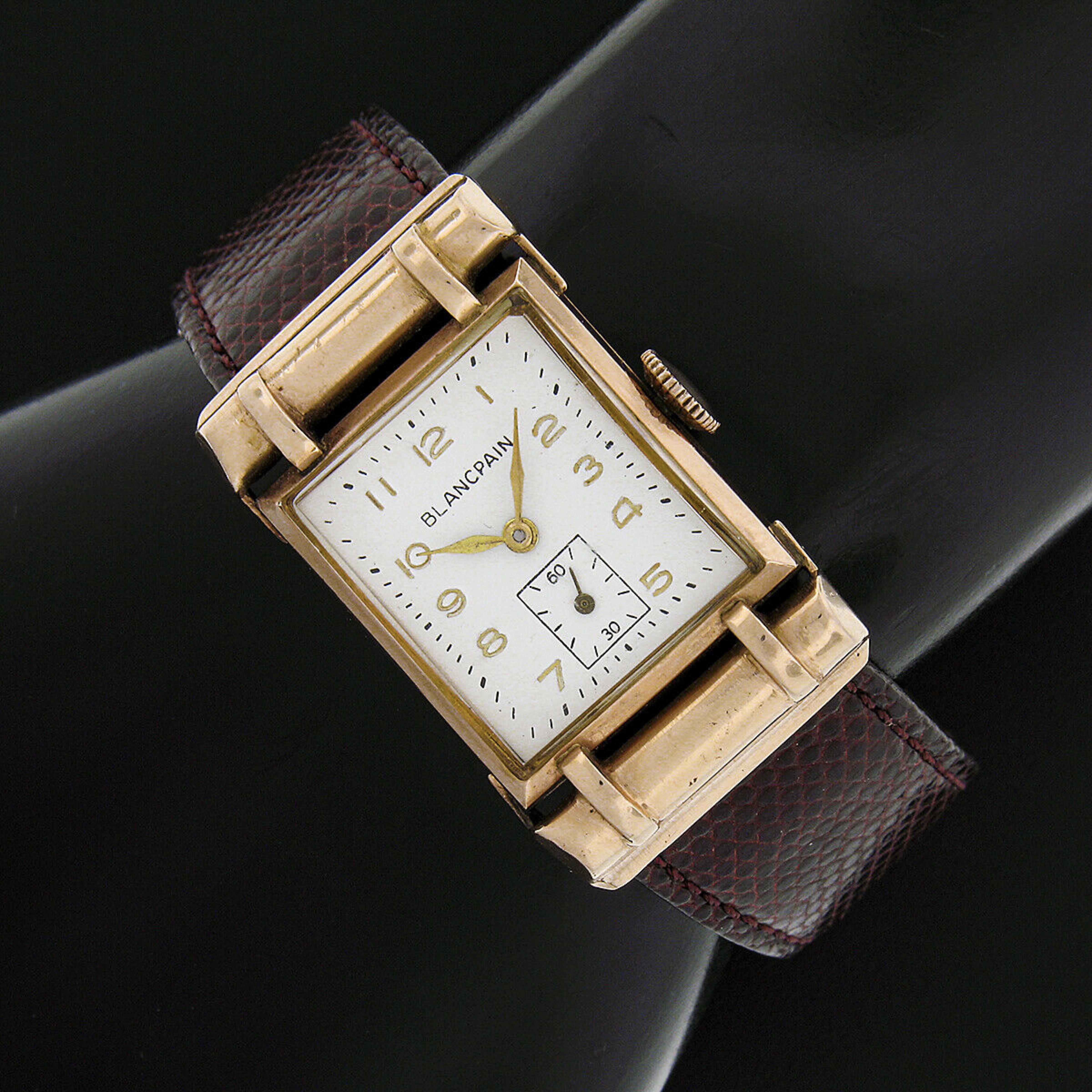 Here we have a classy vintage Blancpain wrist watch featuring its original hand winding movement that continues to keep accurate time. The movement is mounted in a solid 14k rose gold rectangular case that has been lightly polished. The case is