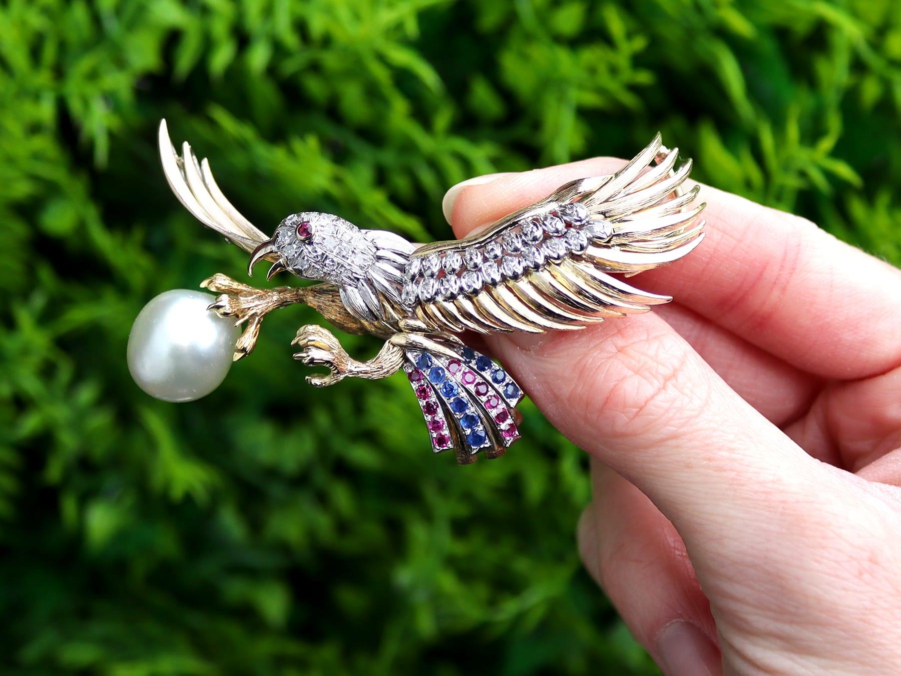 A magnificent, fine and impressive vintage blister pearl, 0.30 carat sapphire, 0.28 carat ruby and 1.28 carat diamond, 14 karat yellow gold and 9 karat white gold set eagle brooch; part of our diverse collection of bird brooches.

This magnificent,