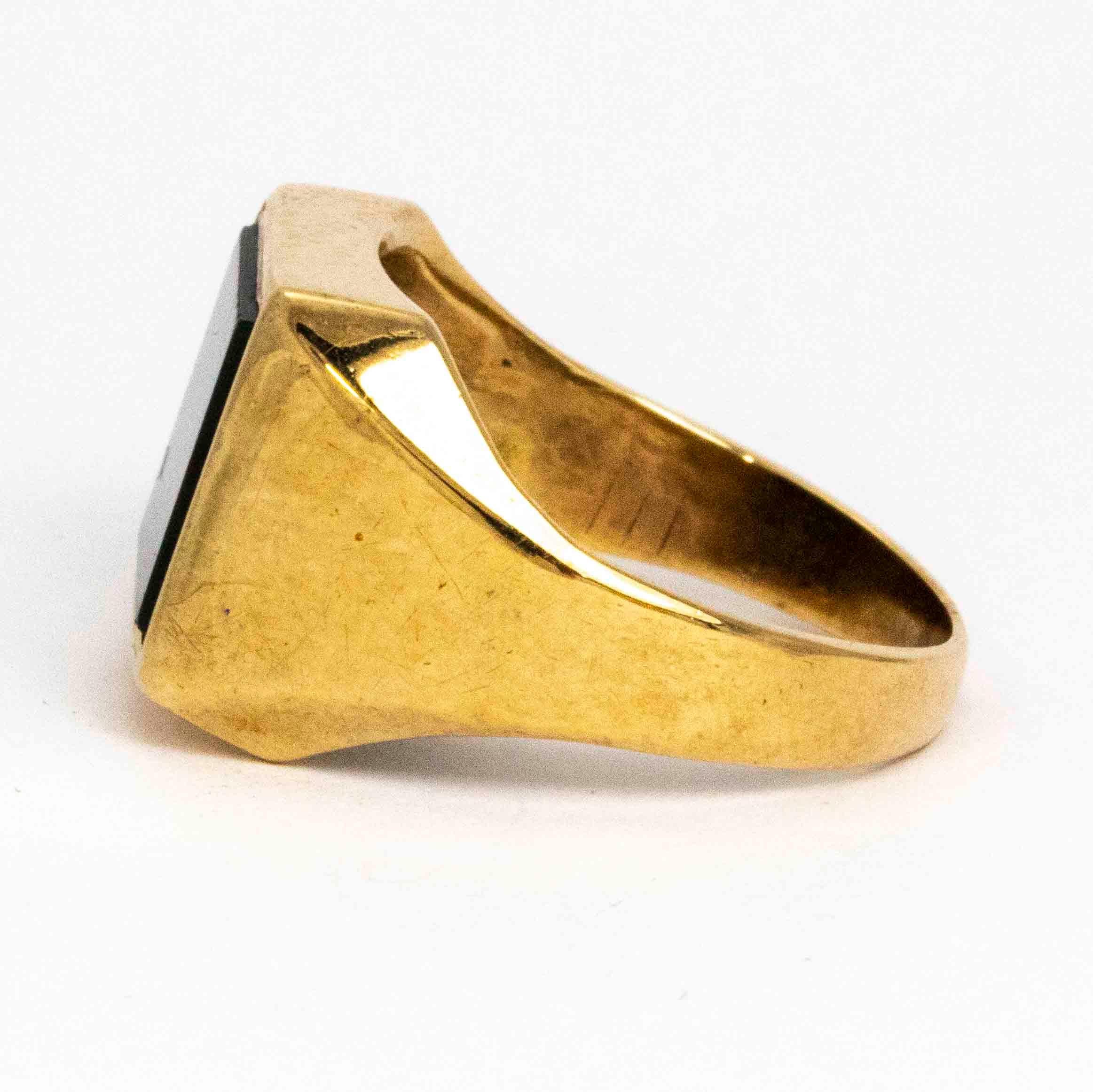 This chunky signet ring has a modern feel to it as the stone and the setting is so angular. The glossy bloodstone is set in 9ct gold. Made in Birmingham, England.

Ring Size: Q or 8 
Stone Dimensions: 10mm x 10mm 


