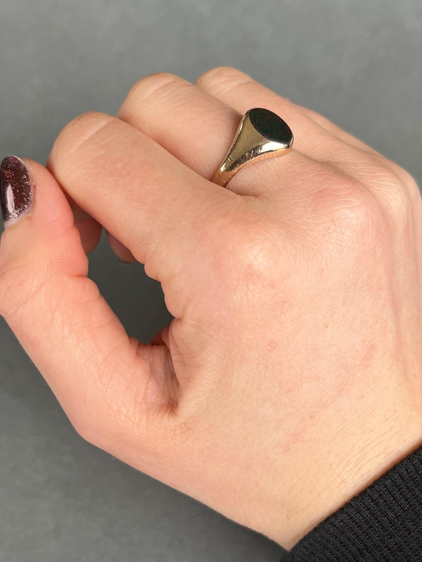 This gorgeous signet ring has a bloodstone set within the 9carat gold band. The stone is deep green with flecks of red running through. Fully hallmarked London 1968.

Ring Size: N or 6 3/4
Stone dimensions: 10x8mm 

Weight: 3.4g 